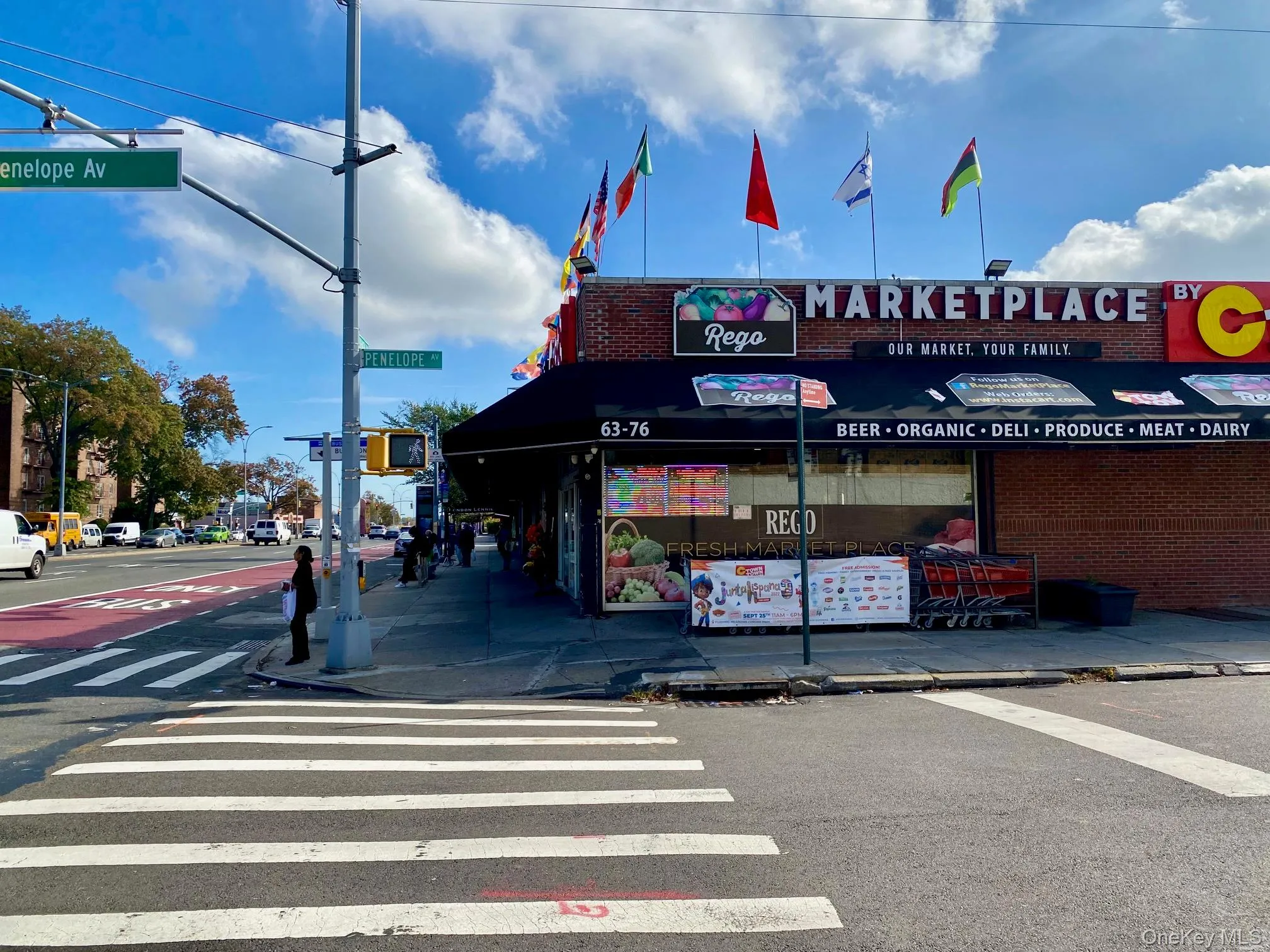 View of asphalt road featuring curbs, sidewalks, and street lights View of asphalt road featuring curbs, sidewalks, and street lights