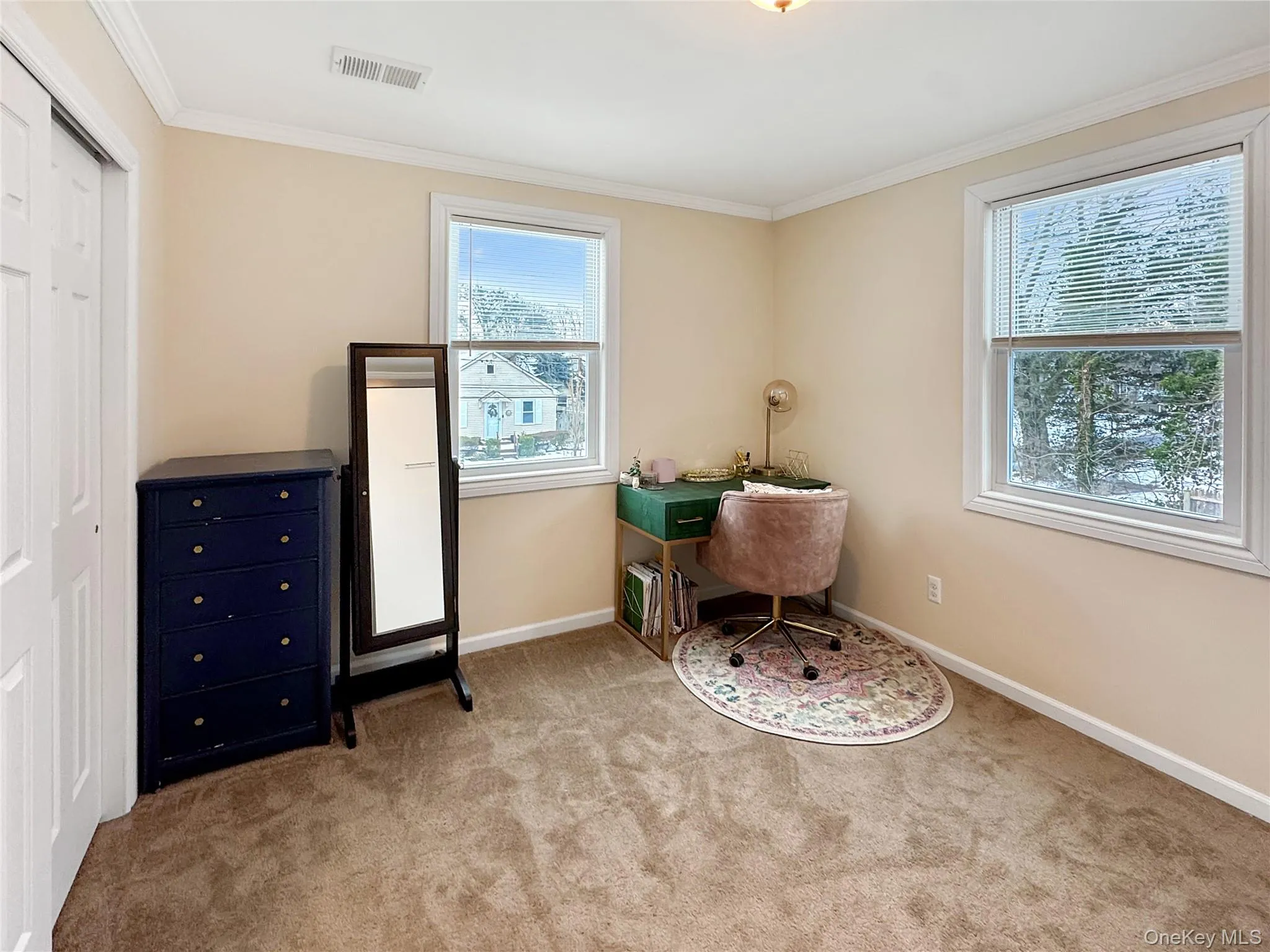 Office area with crown molding and light carpet Office area with crown molding and light carpet