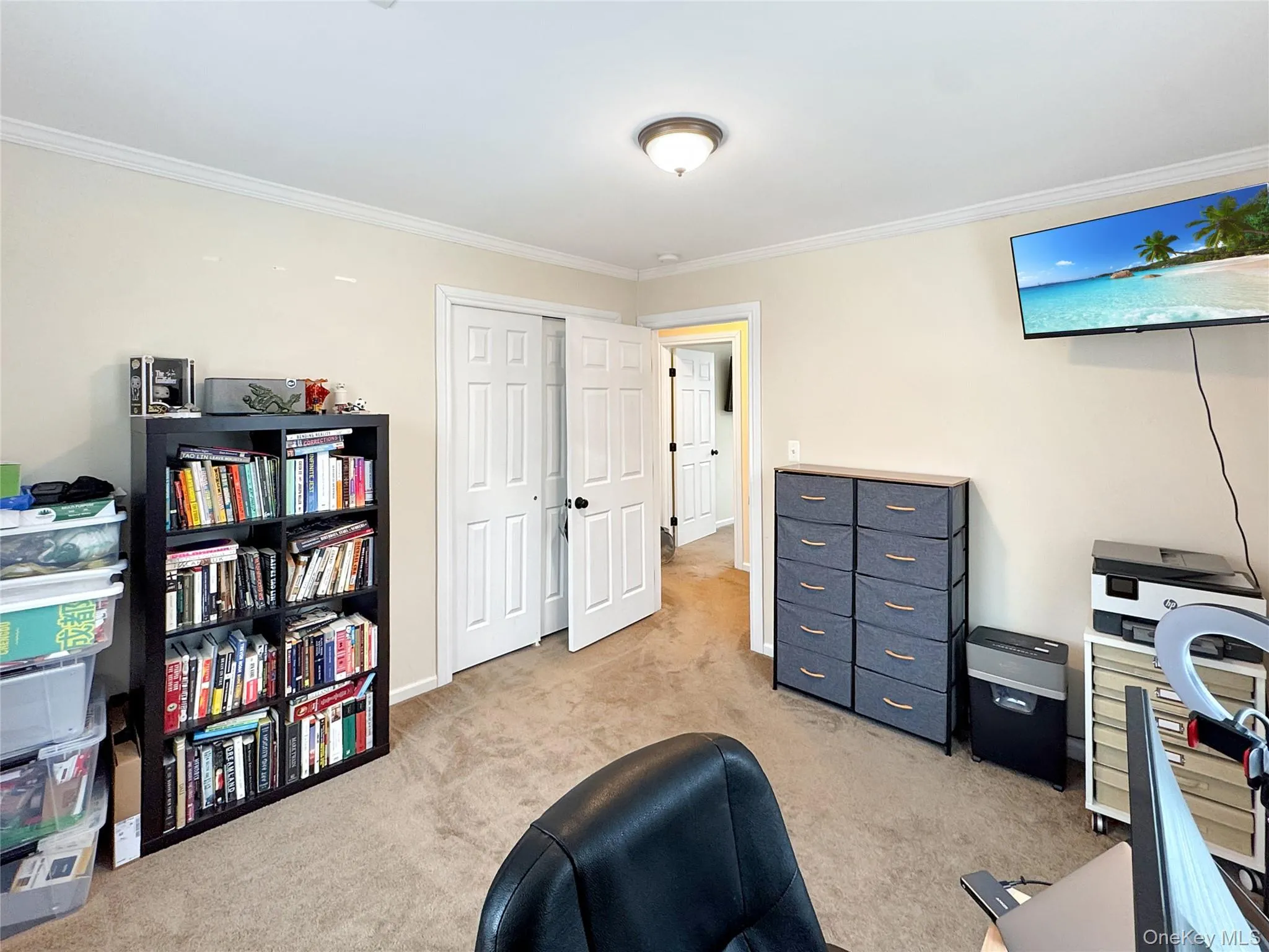 Home office featuring ornamental molding and light carpet Home office featuring ornamental molding and light carpet