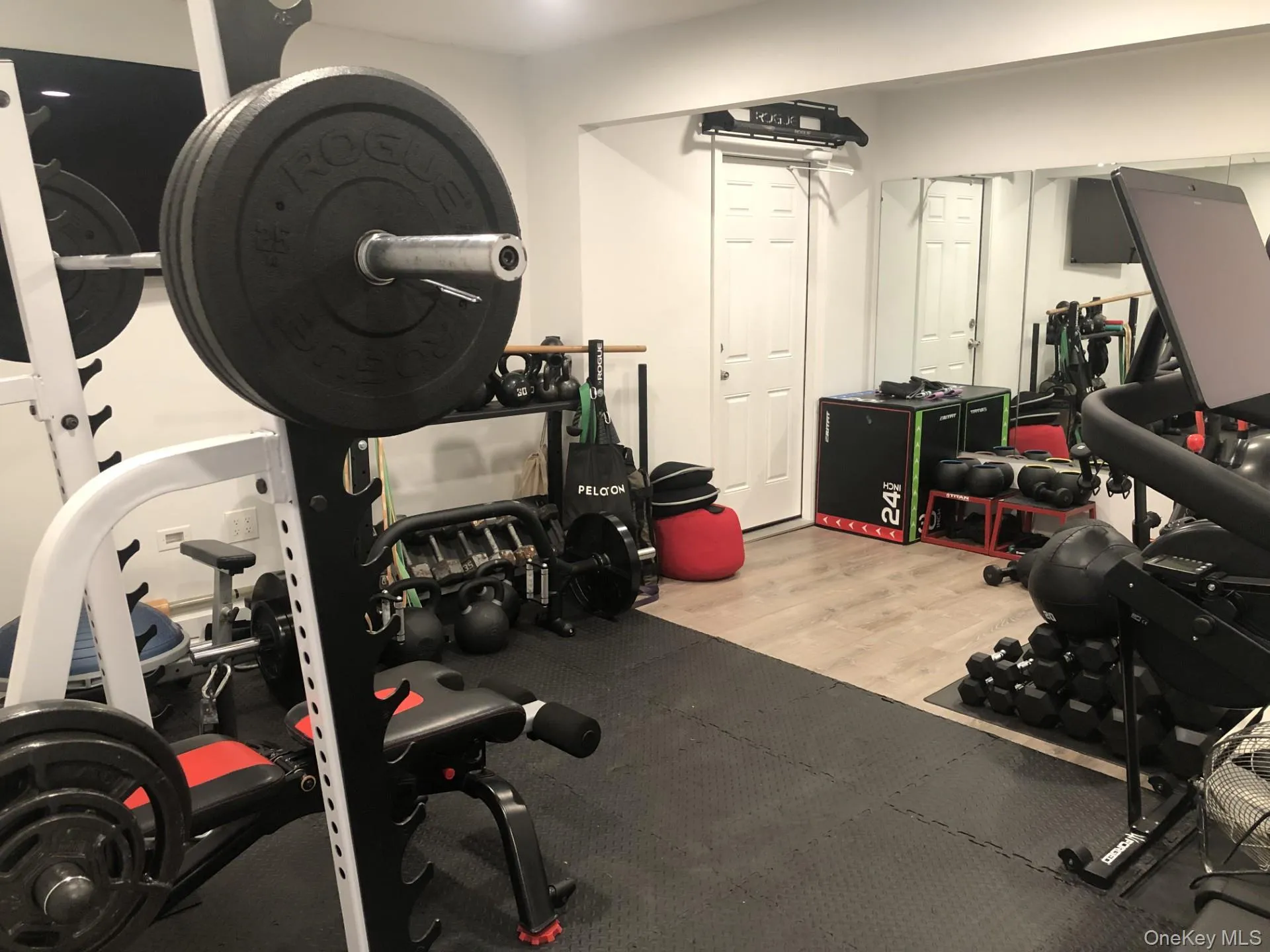 Workout area featuring light wood-style flooring Workout area featuring light wood-style flooring