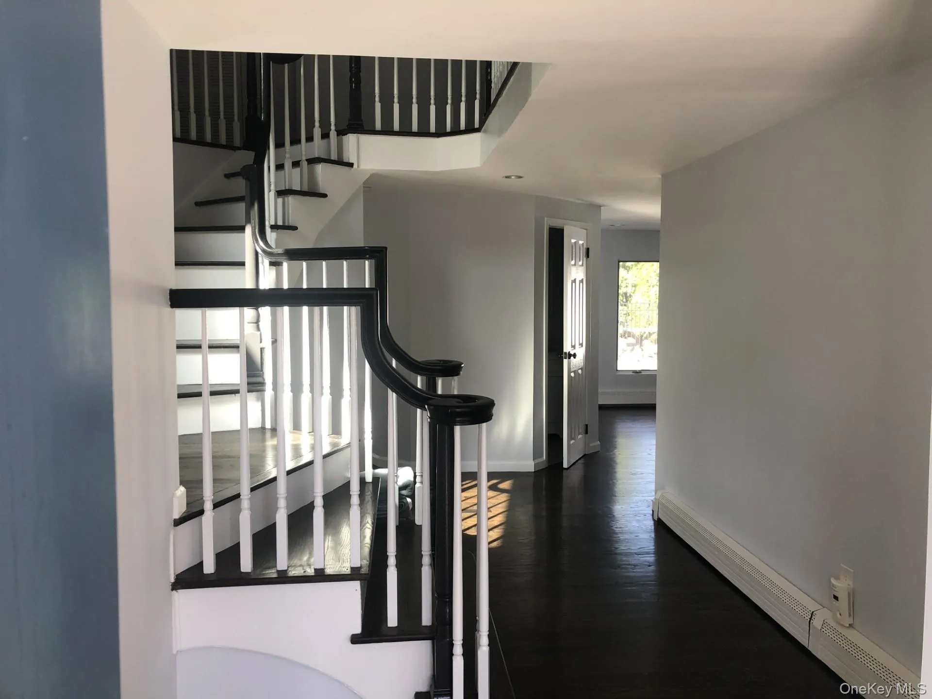 Stairway with wood finished floors and baseboards Stairway with wood finished floors and baseboards