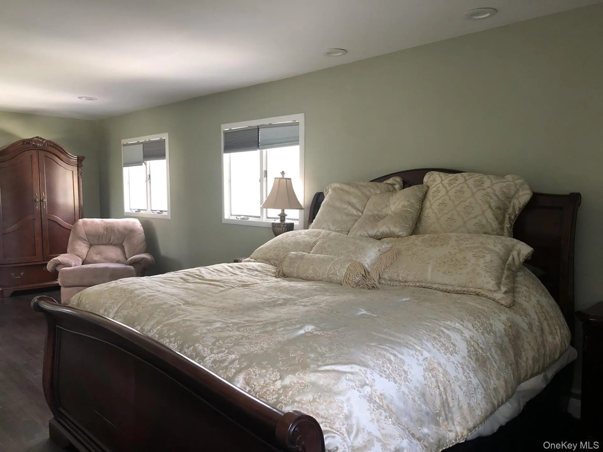 Primary Bedroom with dark wood-type flooring and on suite bath with plenty of closet space. Primary Bedroom with dark wood-type flooring and on suite bath with plenty of closet space.