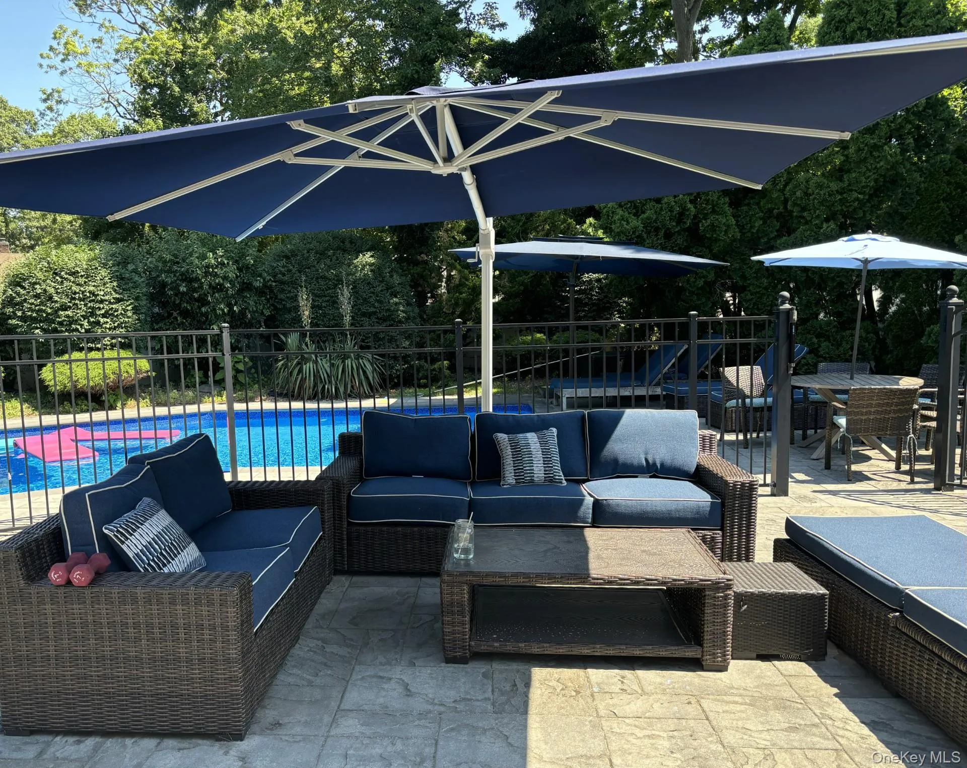 View of patio / terrace with a fenced in pool, fence, and an outdoor living space View of patio / terrace with a fenced in pool, fence, and an outdoor living space