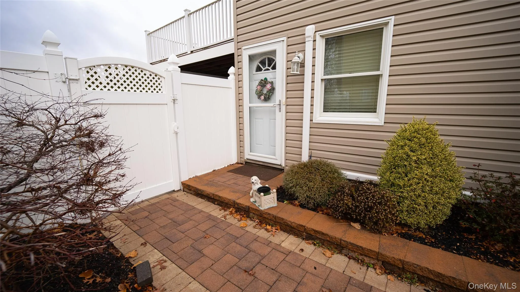 View of exterior entry featuring a gate View of exterior entry featuring a gate