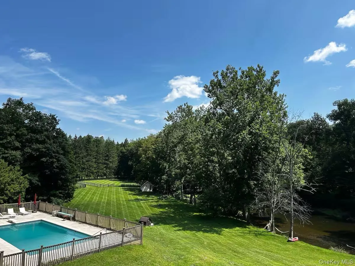 View of pool and yard from the house View of pool and yard from the house
