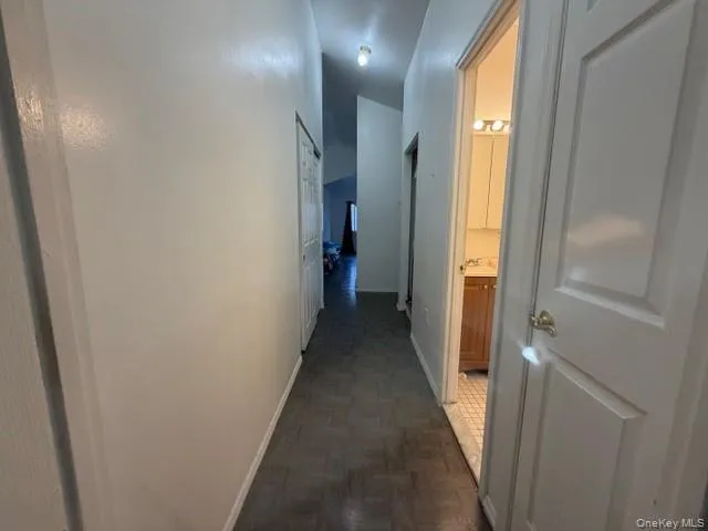 Hall featuring baseboards Hall featuring baseboards