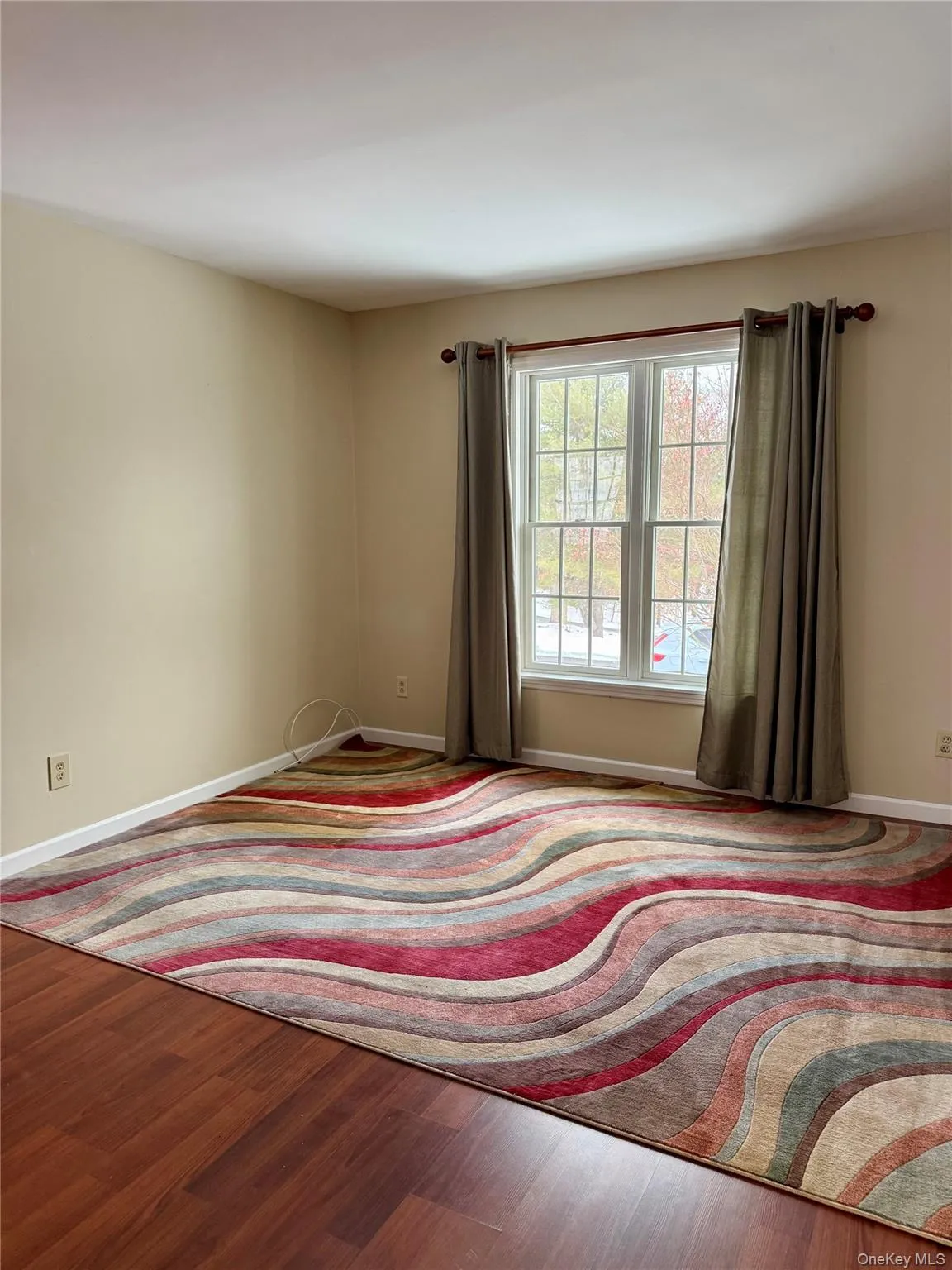 Bedroom with wood finished floors and baseboards Bedroom with wood finished floors and baseboards