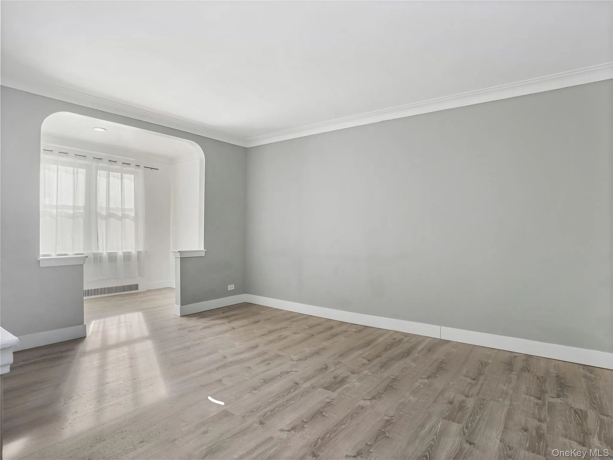 Living room has wood floor and crown molding Living room has wood floor and crown molding