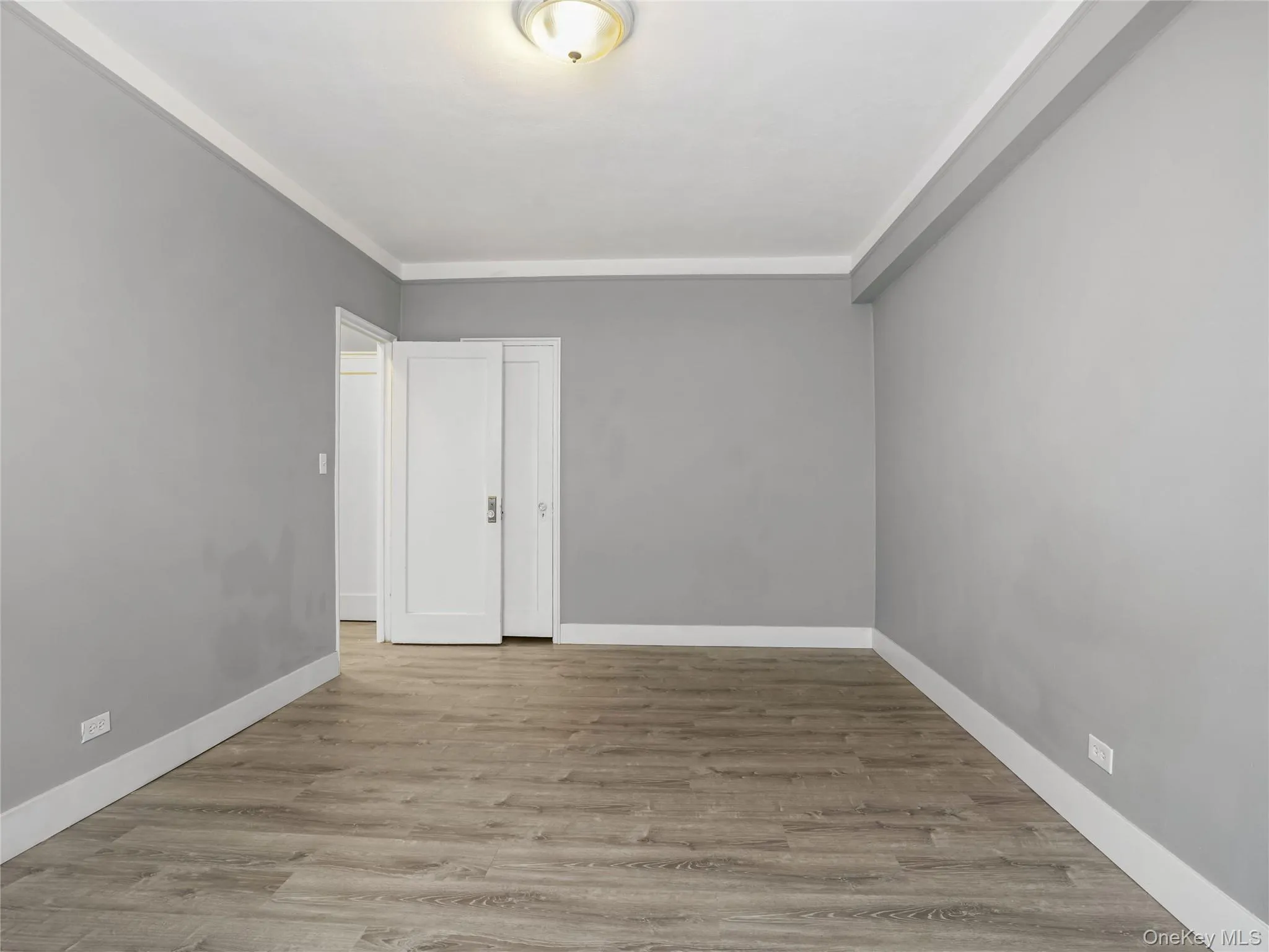 View of bedroom from window show closet door behind the entrance View of bedroom from window show closet door behind the entrance