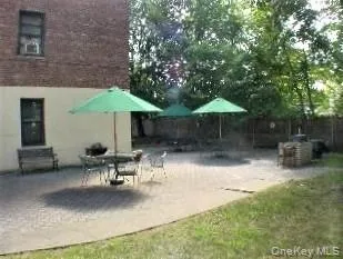 Private BBQ and patio for the building. Private BBQ and patio for the building.