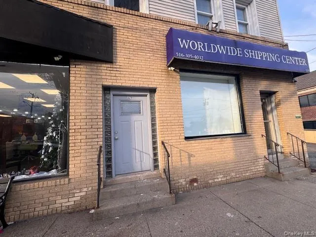 Property entrance with brick siding Property entrance with brick siding