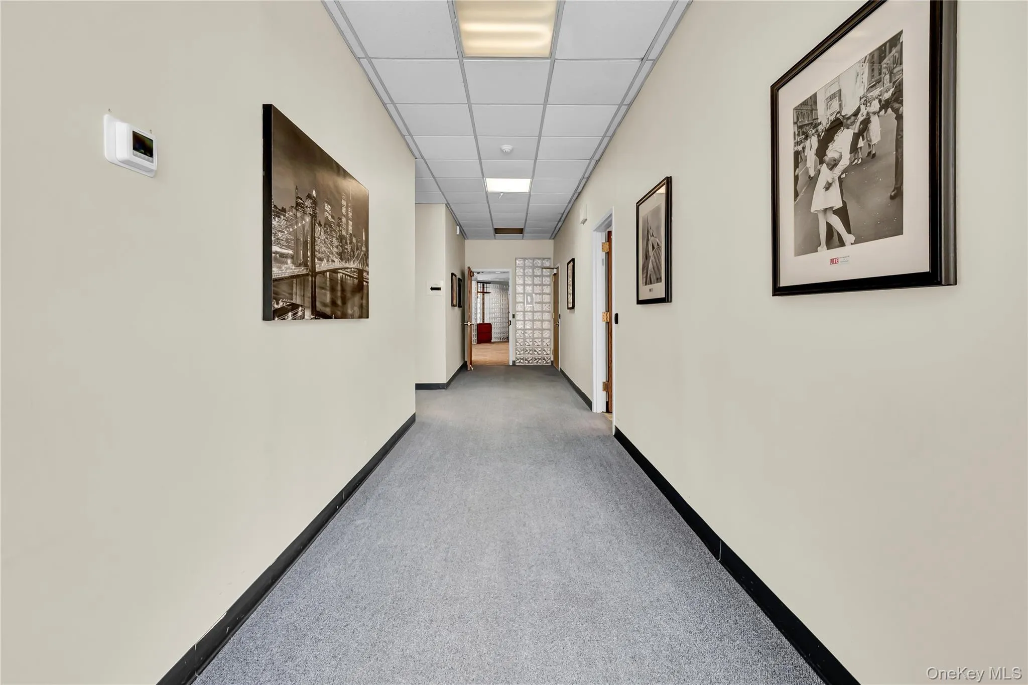 Hall with a drop ceiling and carpet Hall with a drop ceiling and carpet