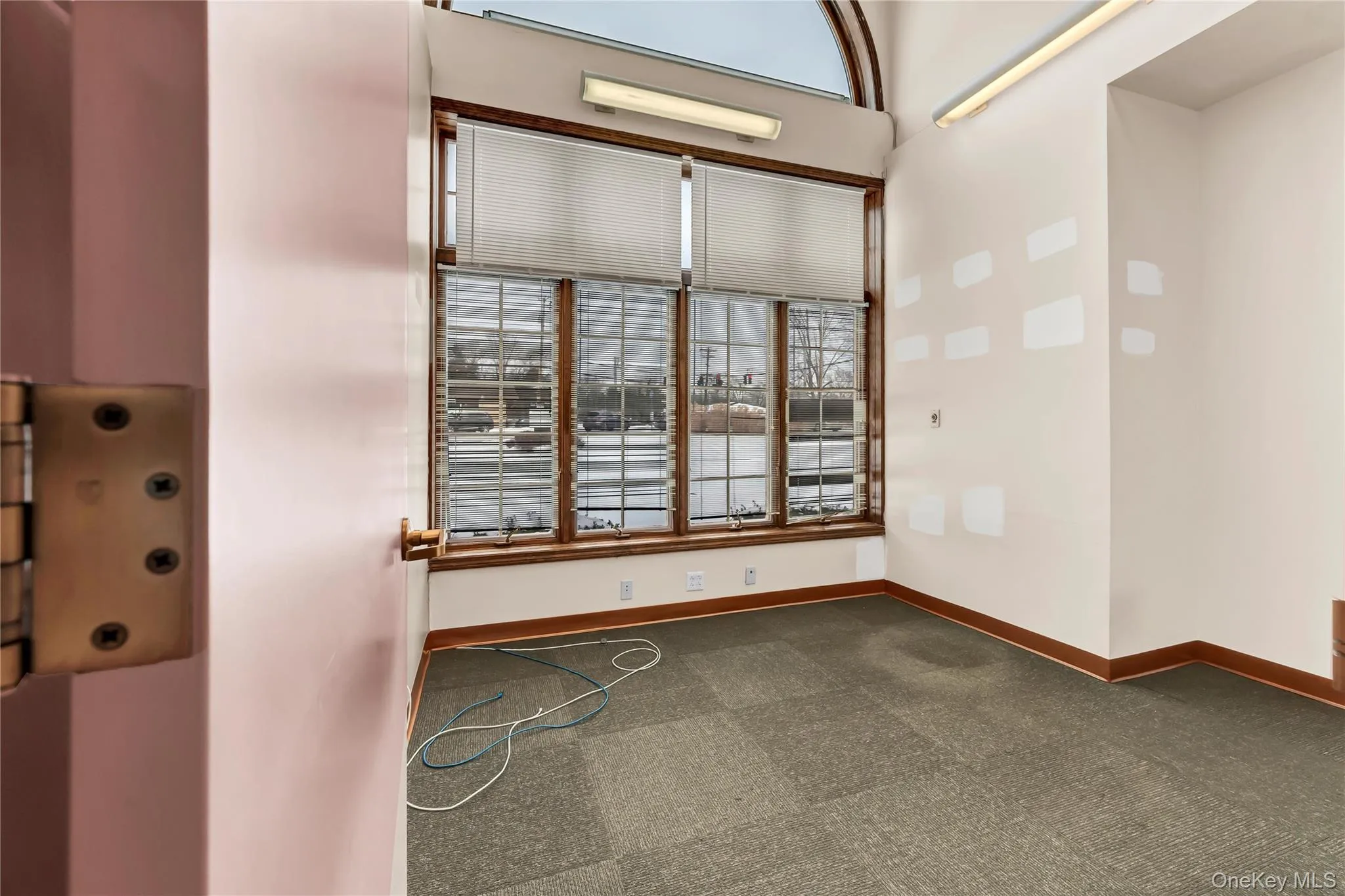 Spare room with dark carpet and elevator Spare room with dark carpet and elevator