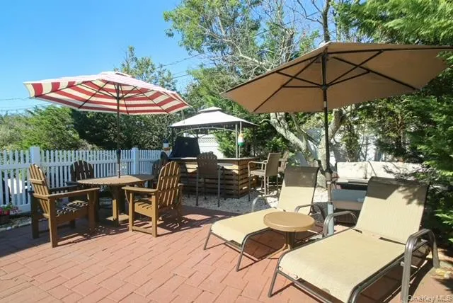 View of patio featuring outdoor dining area and a gazebo View of patio featuring outdoor dining area and a gazebo