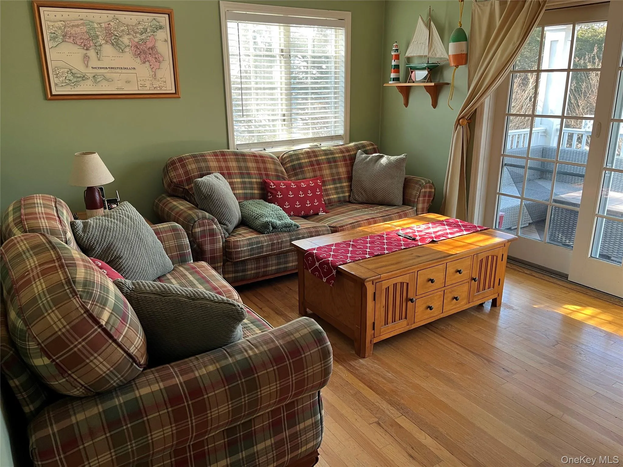 Living area featuring hardwood / wood-style floors Living area featuring hardwood / wood-style floors