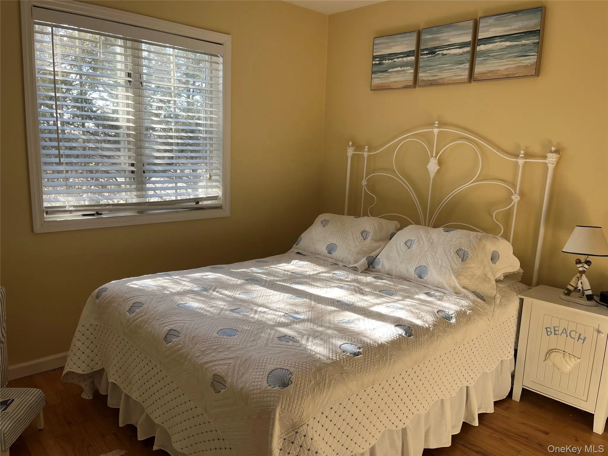 Bedroom featuring dark wood-style floors Bedroom featuring dark wood-style floors