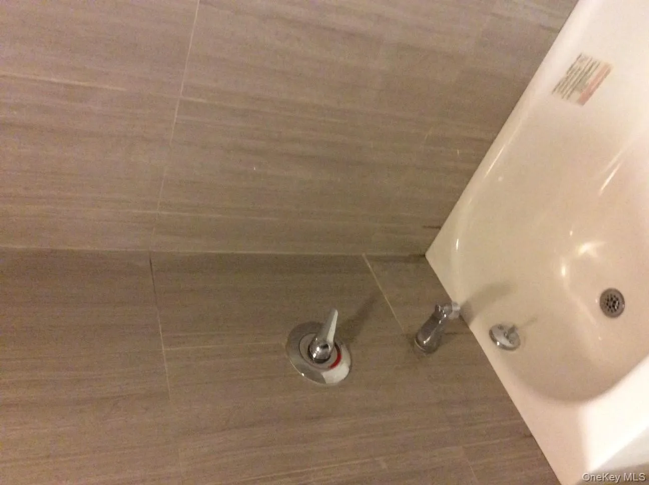 Bathroom featuring bathing tub / shower combination Bathroom featuring bathing tub / shower combination