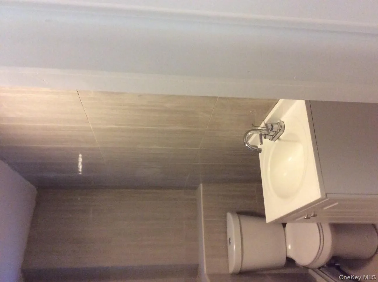 Bathroom featuring vanity and toilet Bathroom featuring vanity and toilet