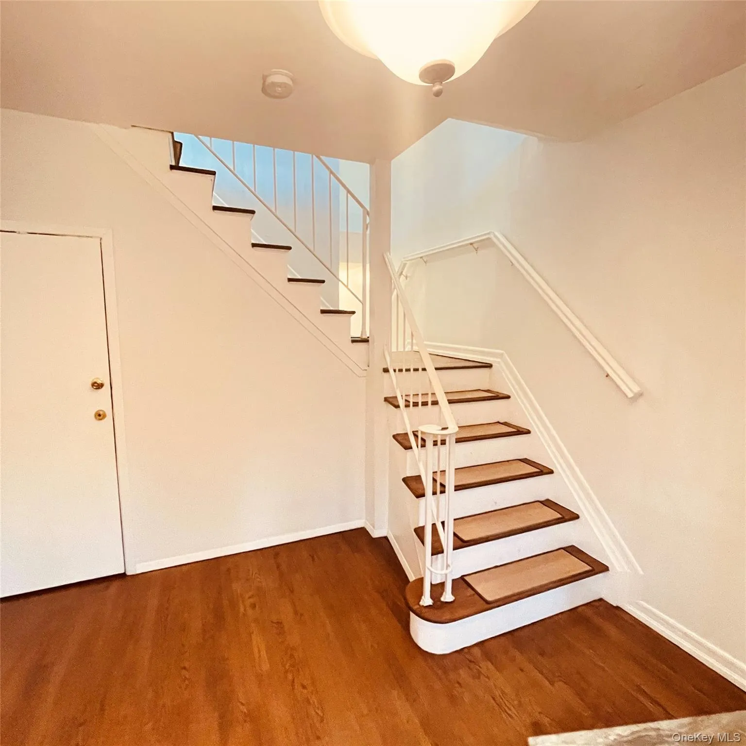 Staircase with wood finished floors Staircase with wood finished floors