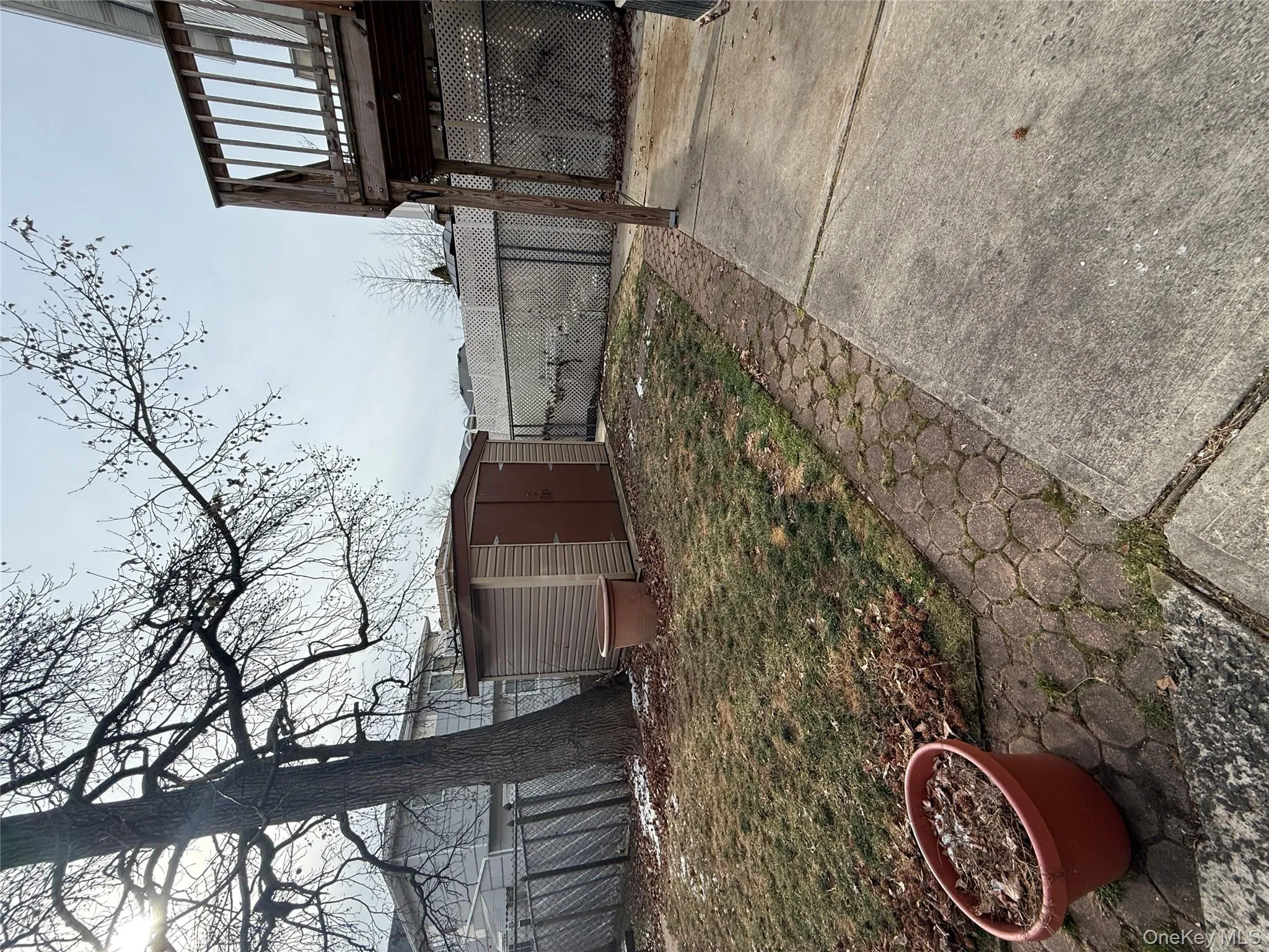 Fenced backyard featuring a shed and a deck Fenced backyard featuring a shed and a deck