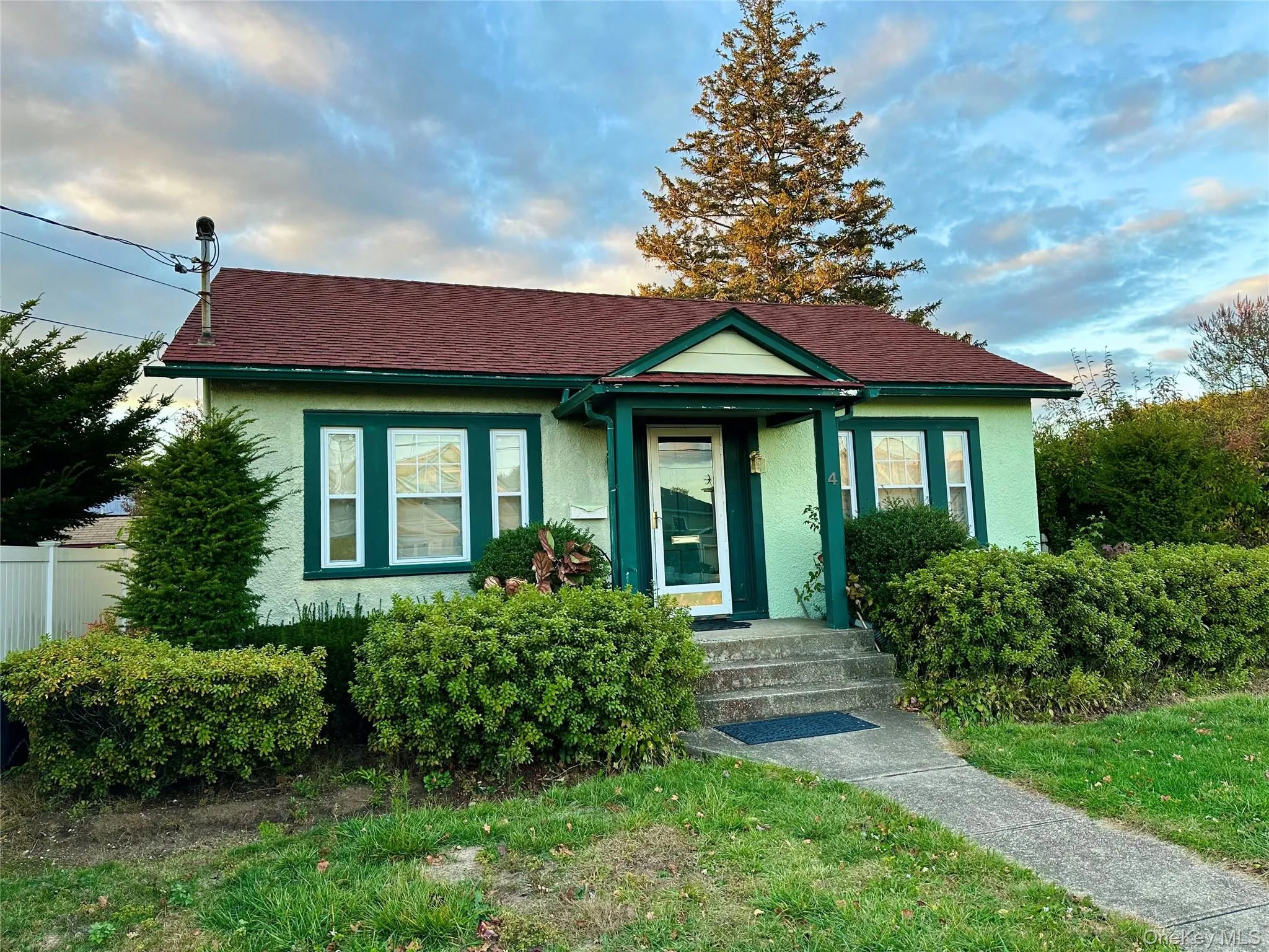 Bungalow-style house featuring stucco siding and roof with shingles Bungalow-style house featuring stucco siding and roof with shingles