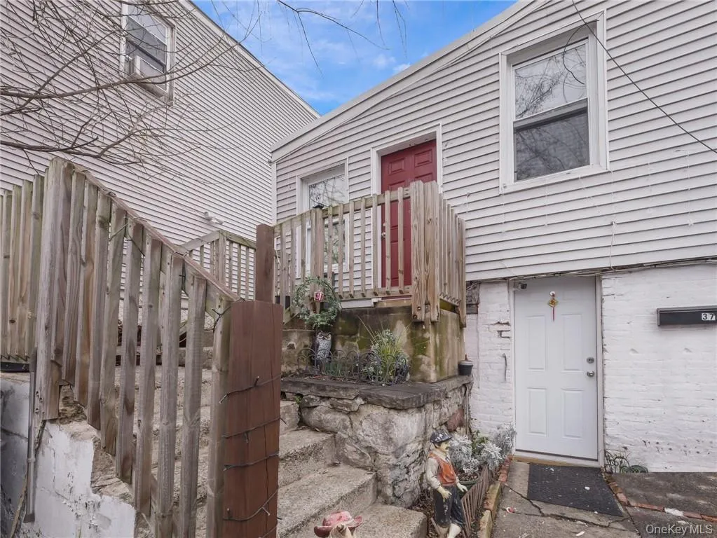 Property entrance featuring brick siding Property entrance featuring brick siding