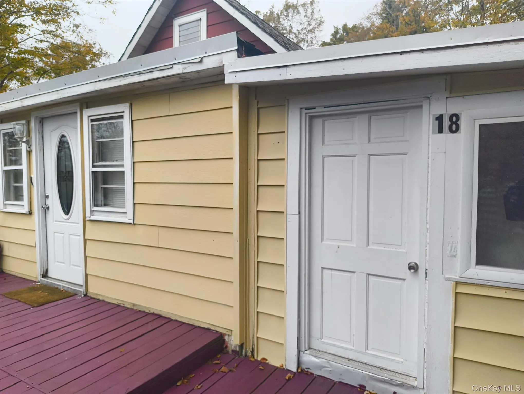 Entrance to property with a wooden deck Entrance to property with a wooden deck