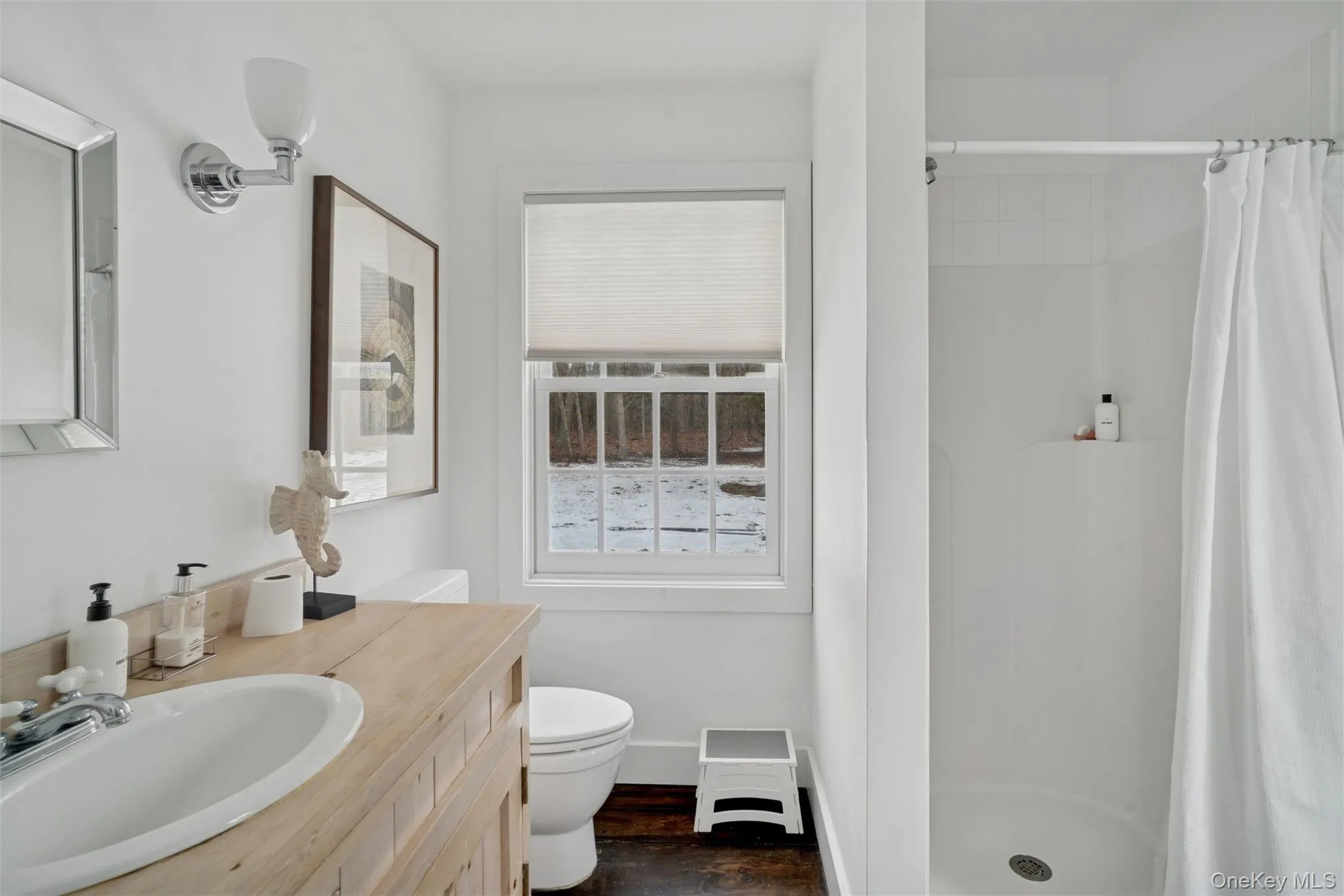 Full bathroom featuring a stall shower and vanity Full bathroom featuring a stall shower and vanity