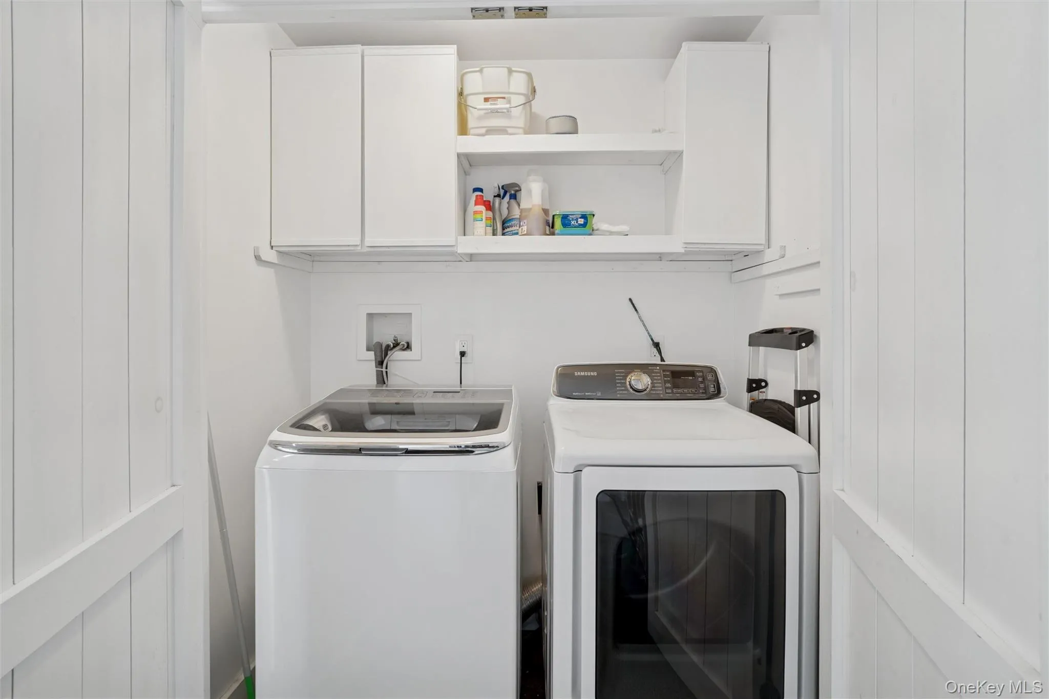 Washroom with cabinet space and independent washer and dryer Washroom with cabinet space and independent washer and dryer