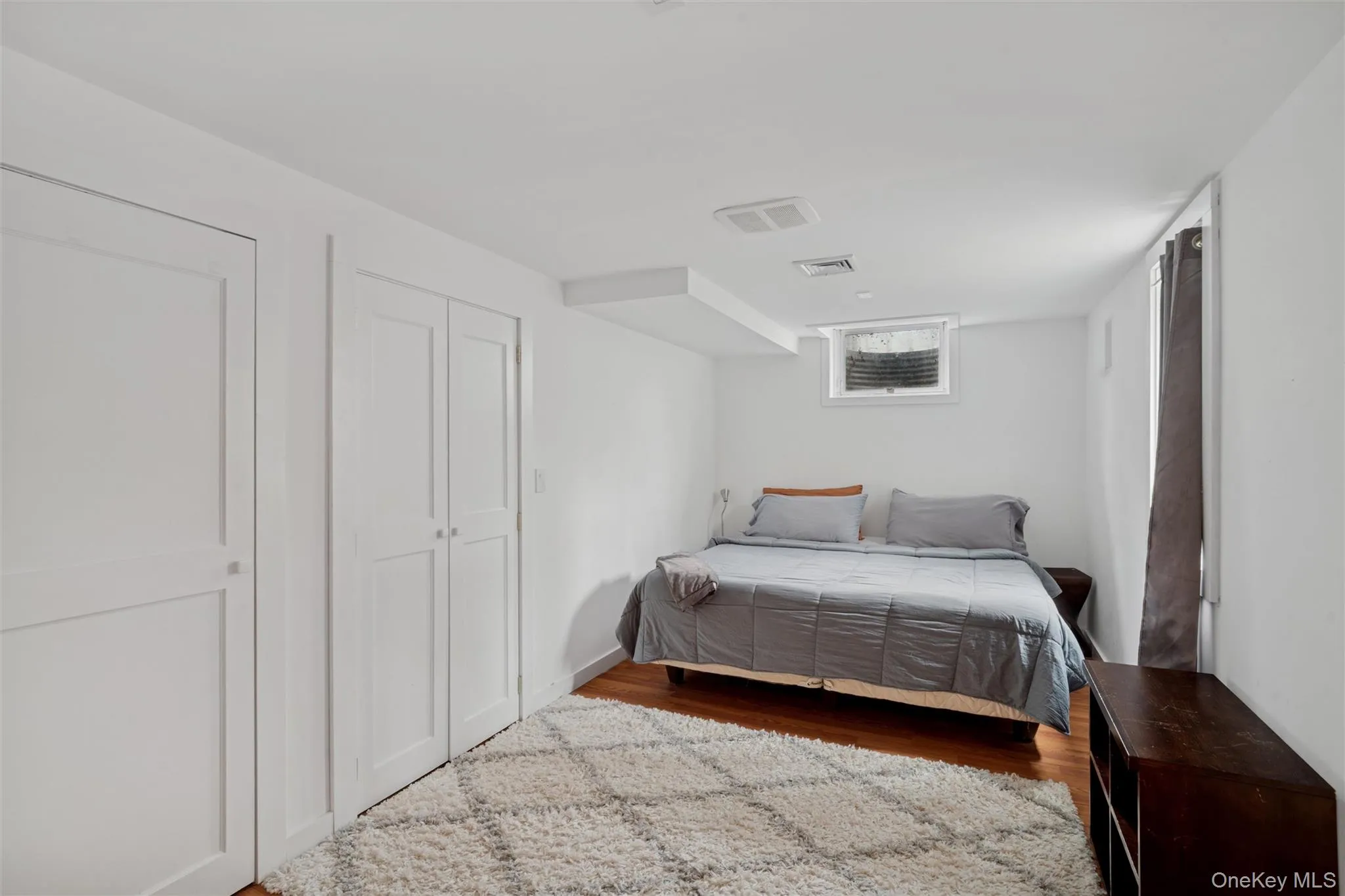 Bedroom with wood finished floors Bedroom with wood finished floors