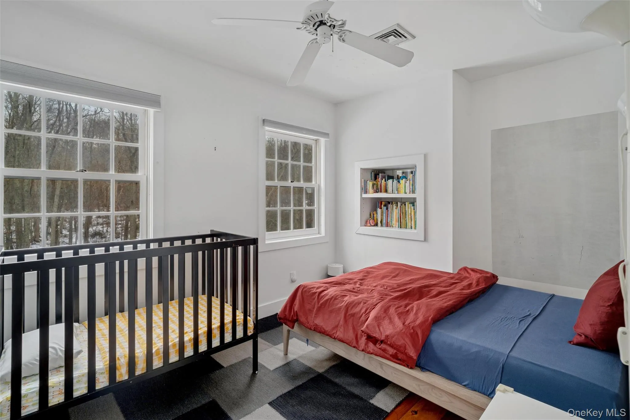 Bedroom featuring a ceiling fan and baseboards Bedroom featuring a ceiling fan and baseboards