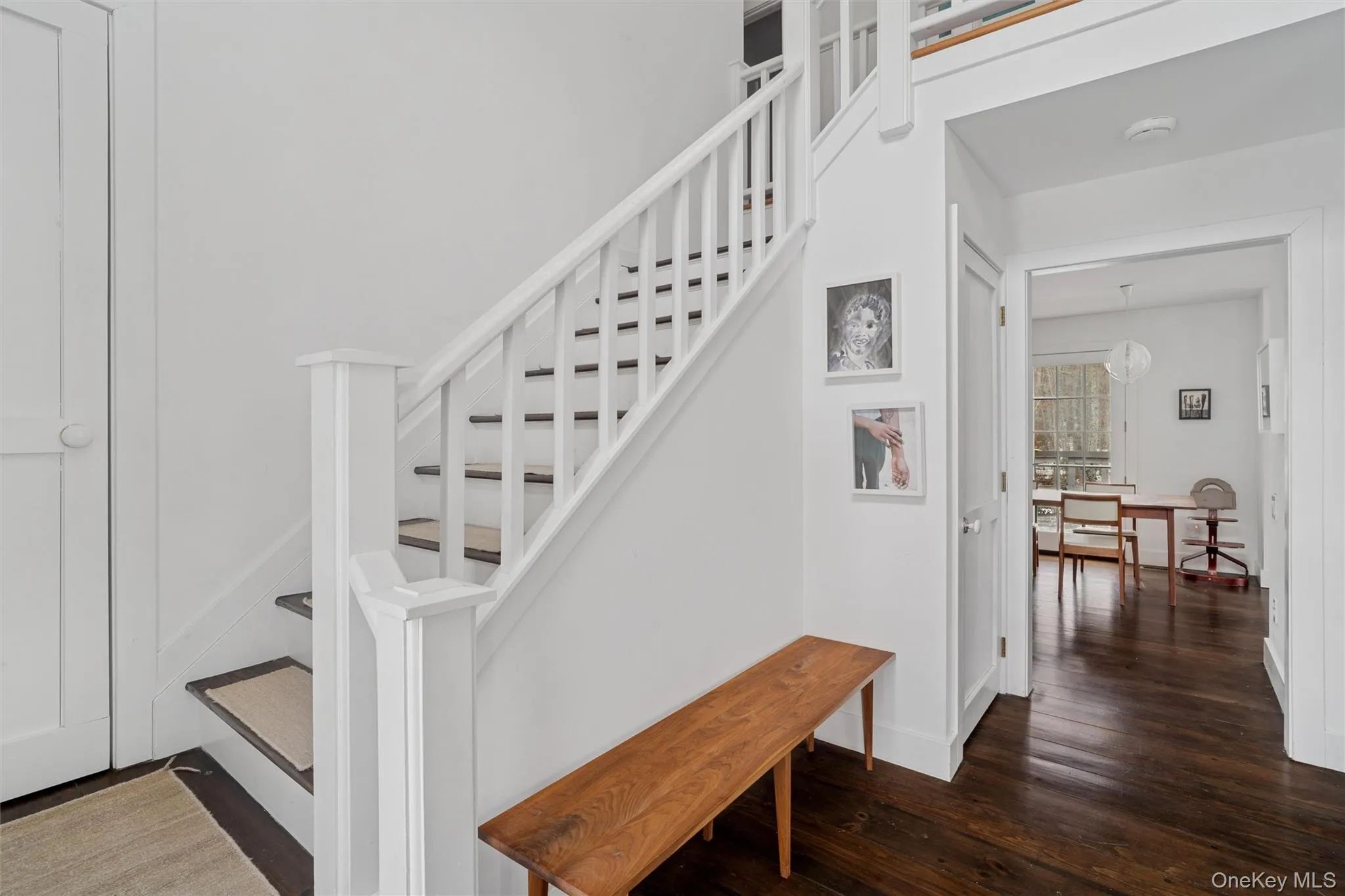 Staircase with hardwood / wood-style flooring and baseboards Staircase with hardwood / wood-style flooring and baseboards