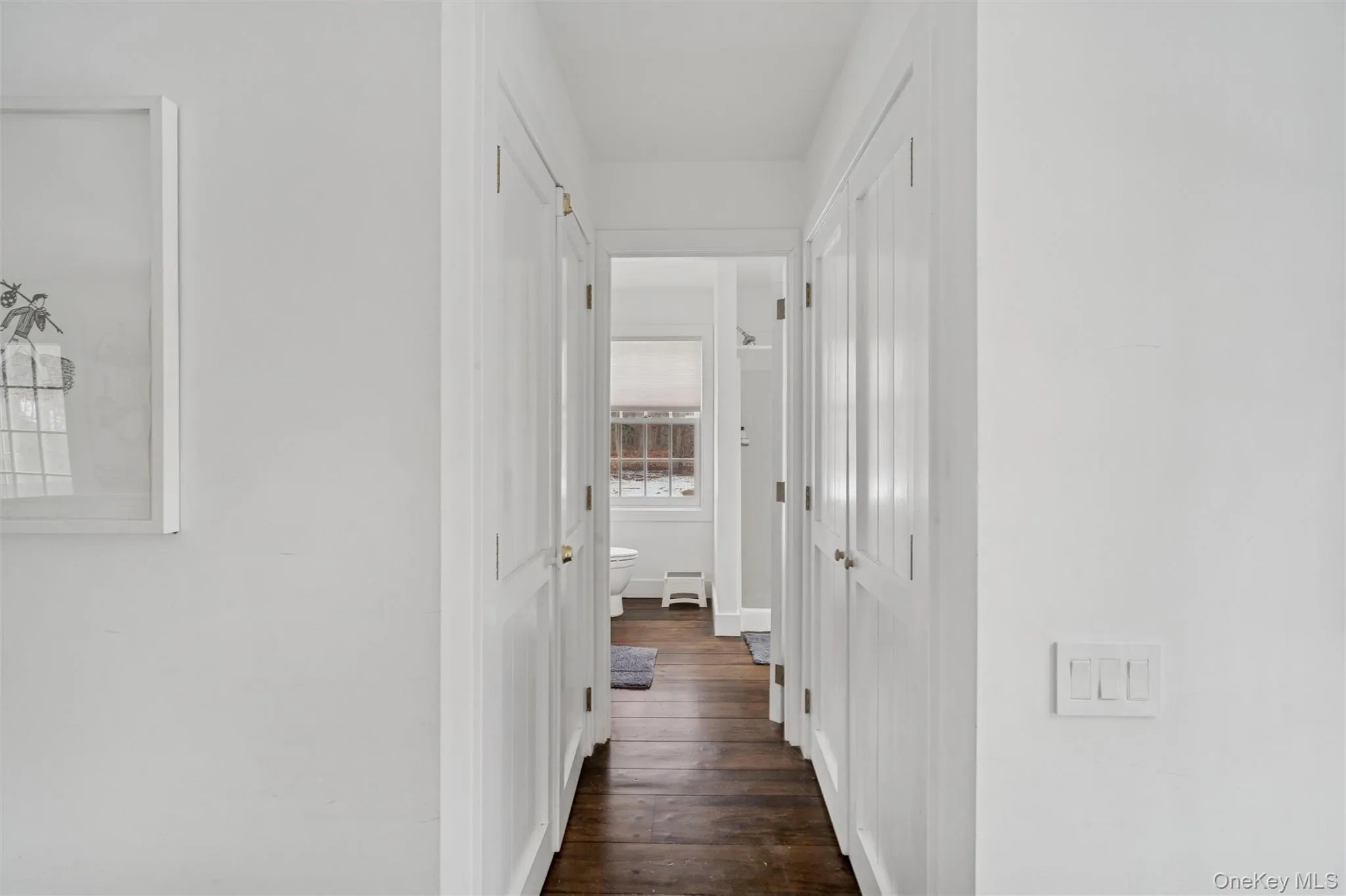 Hallway with dark wood-style flooring Hallway with dark wood-style flooring