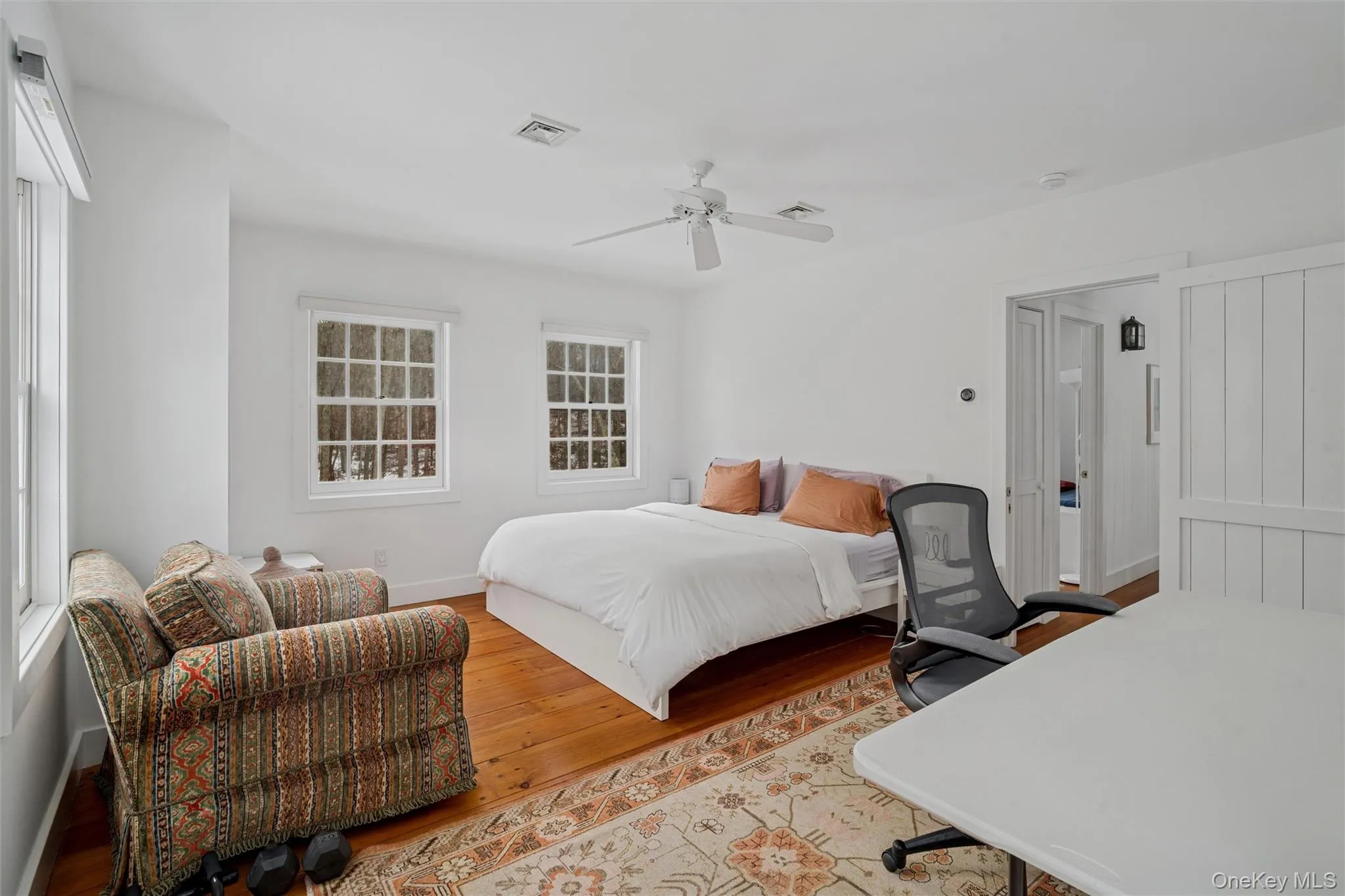Bedroom with hardwood / wood-style floors and ceiling fan Bedroom with hardwood / wood-style floors and ceiling fan