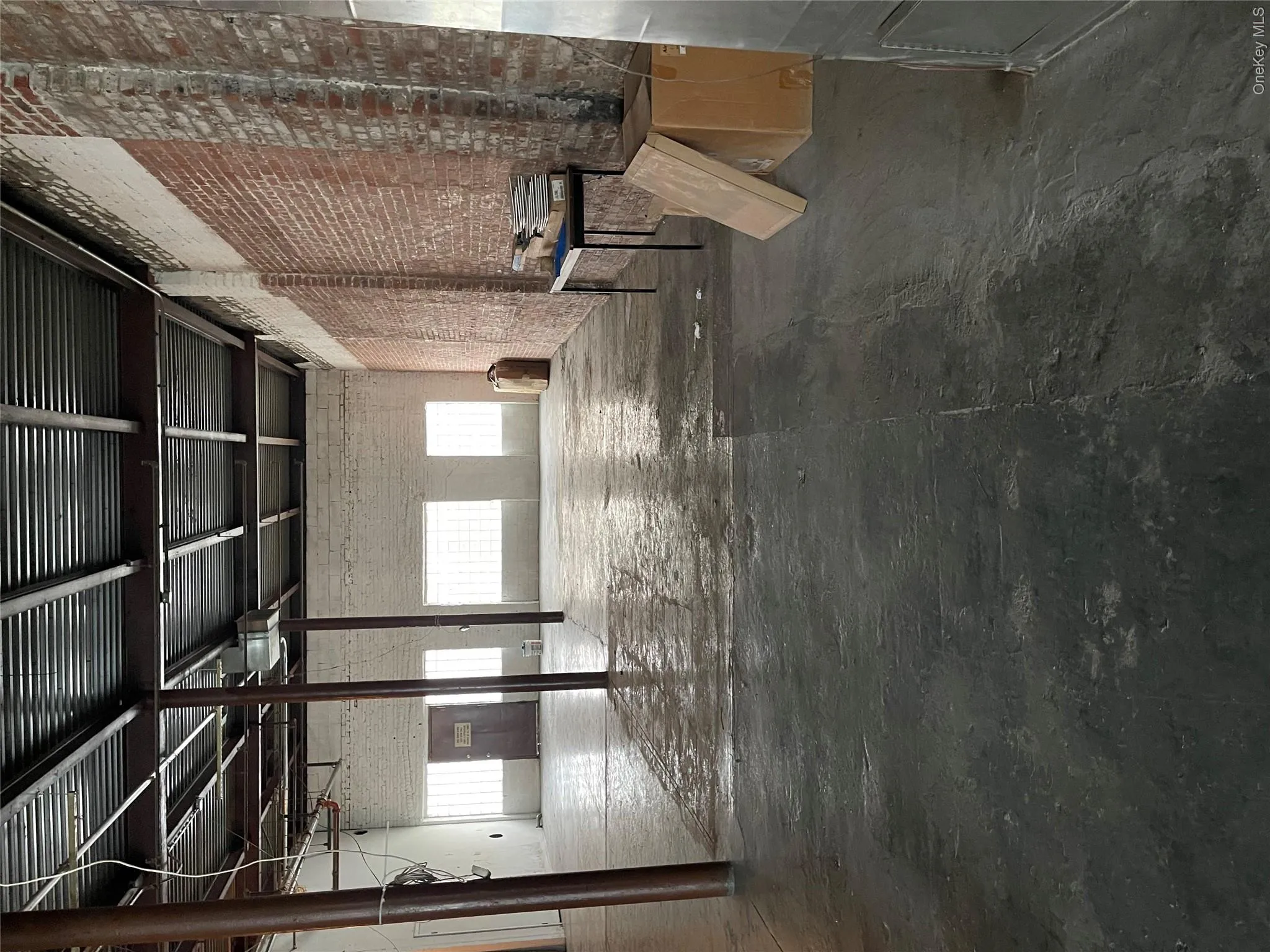 Miscellaneous room with plenty of natural light and brick wall Miscellaneous room with plenty of natural light and brick wall
