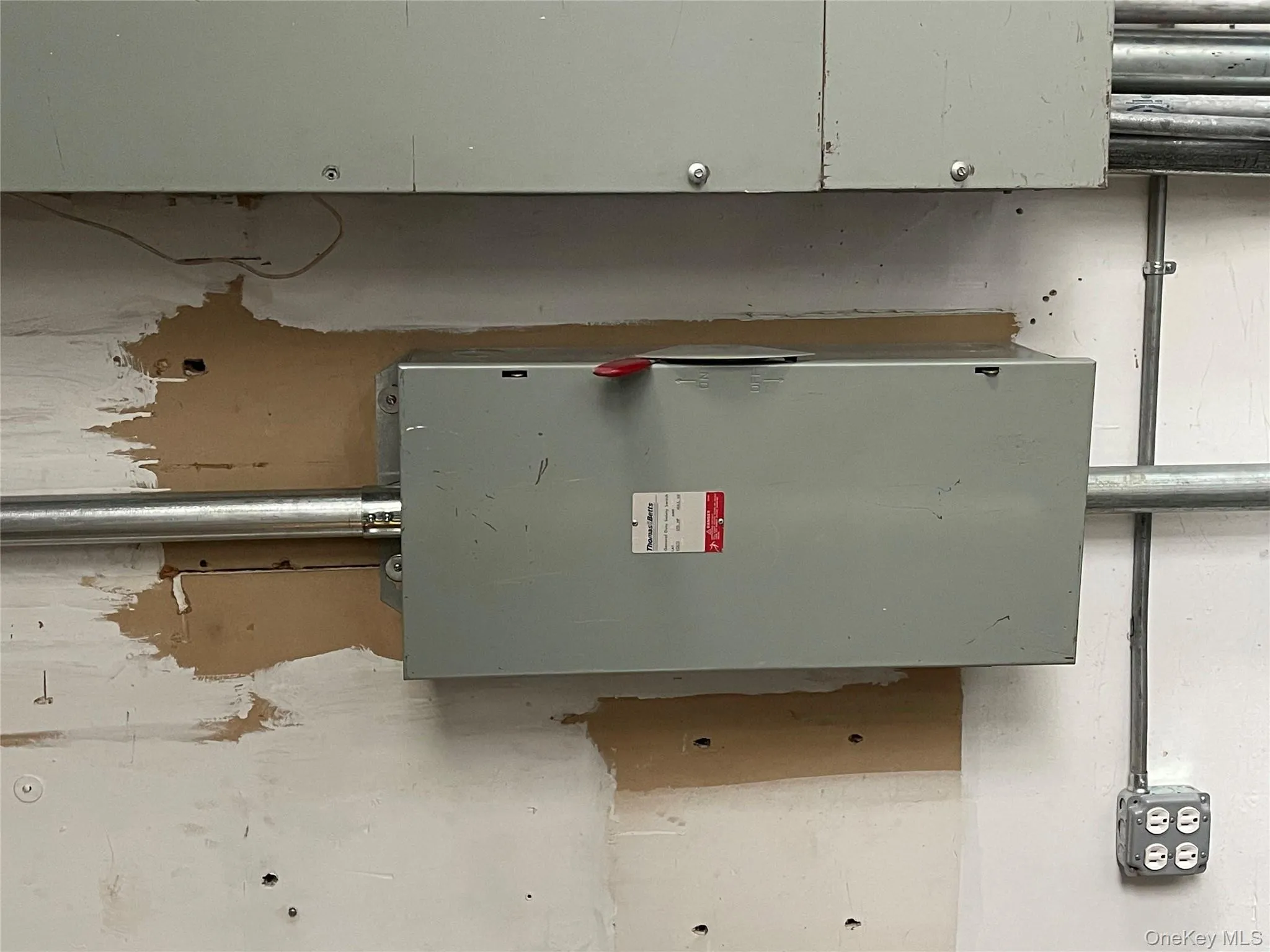 Utility room featuring electric panel Utility room featuring electric panel