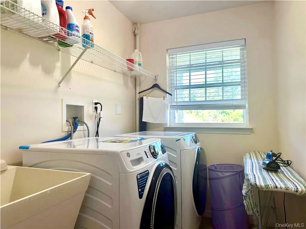 Laundry area with washer and clothes dryer Laundry area with washer and clothes dryer