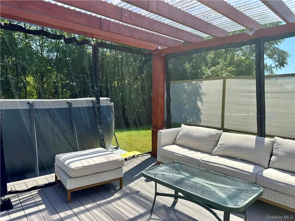 Deck featuring an outdoor living space Deck featuring an outdoor living space