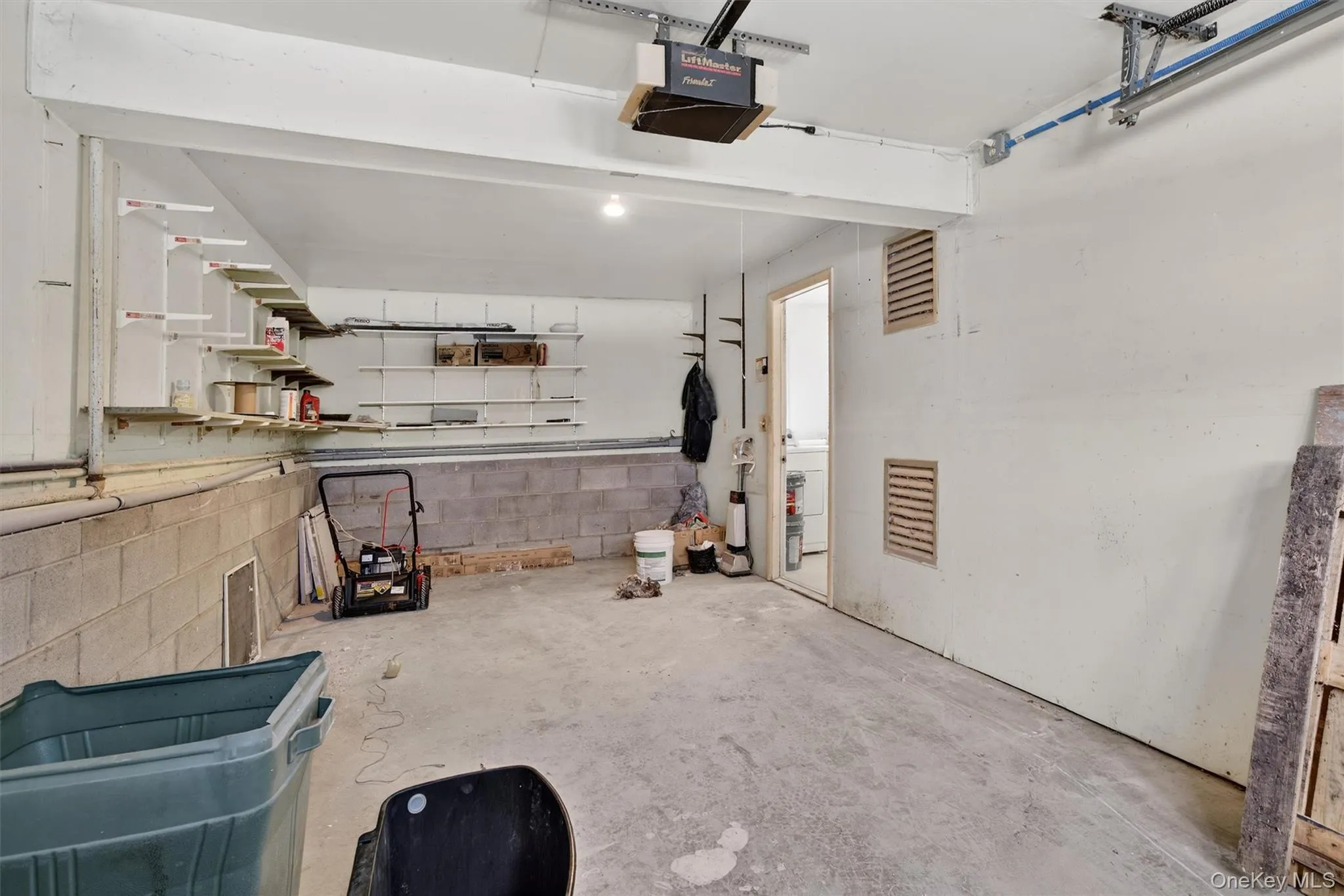 Garage with concrete block wall and a garage door opener Garage with concrete block wall and a garage door opener