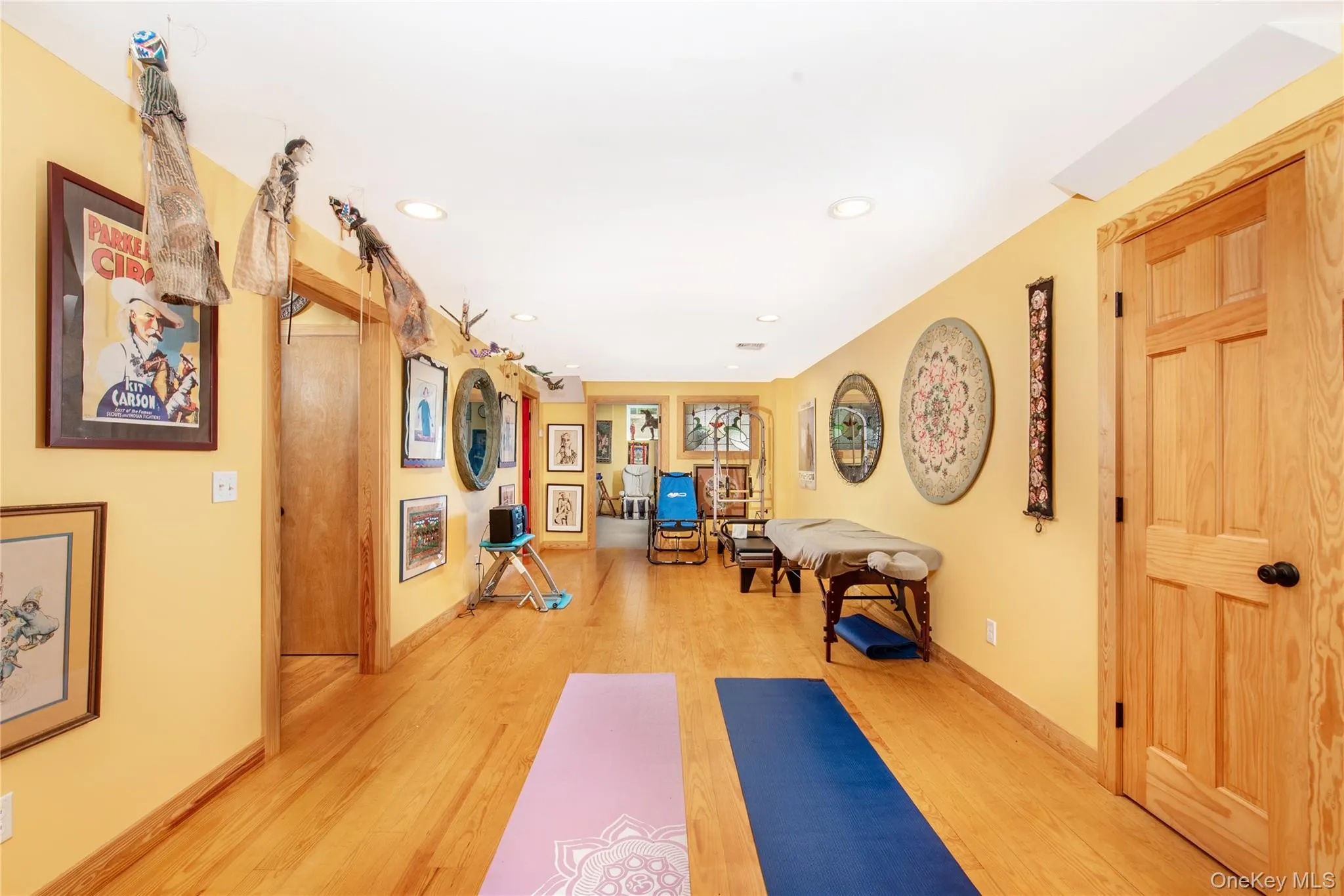 Workout room with light wood-type flooring and recessed lighting Workout room with light wood-type flooring and recessed lighting