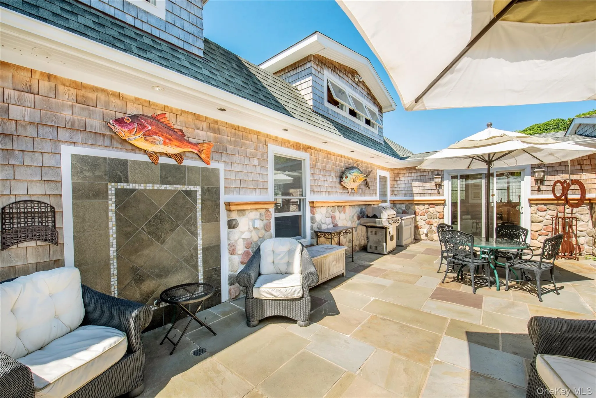 View of patio with outdoor dining area and a grill View of patio with outdoor dining area and a grill