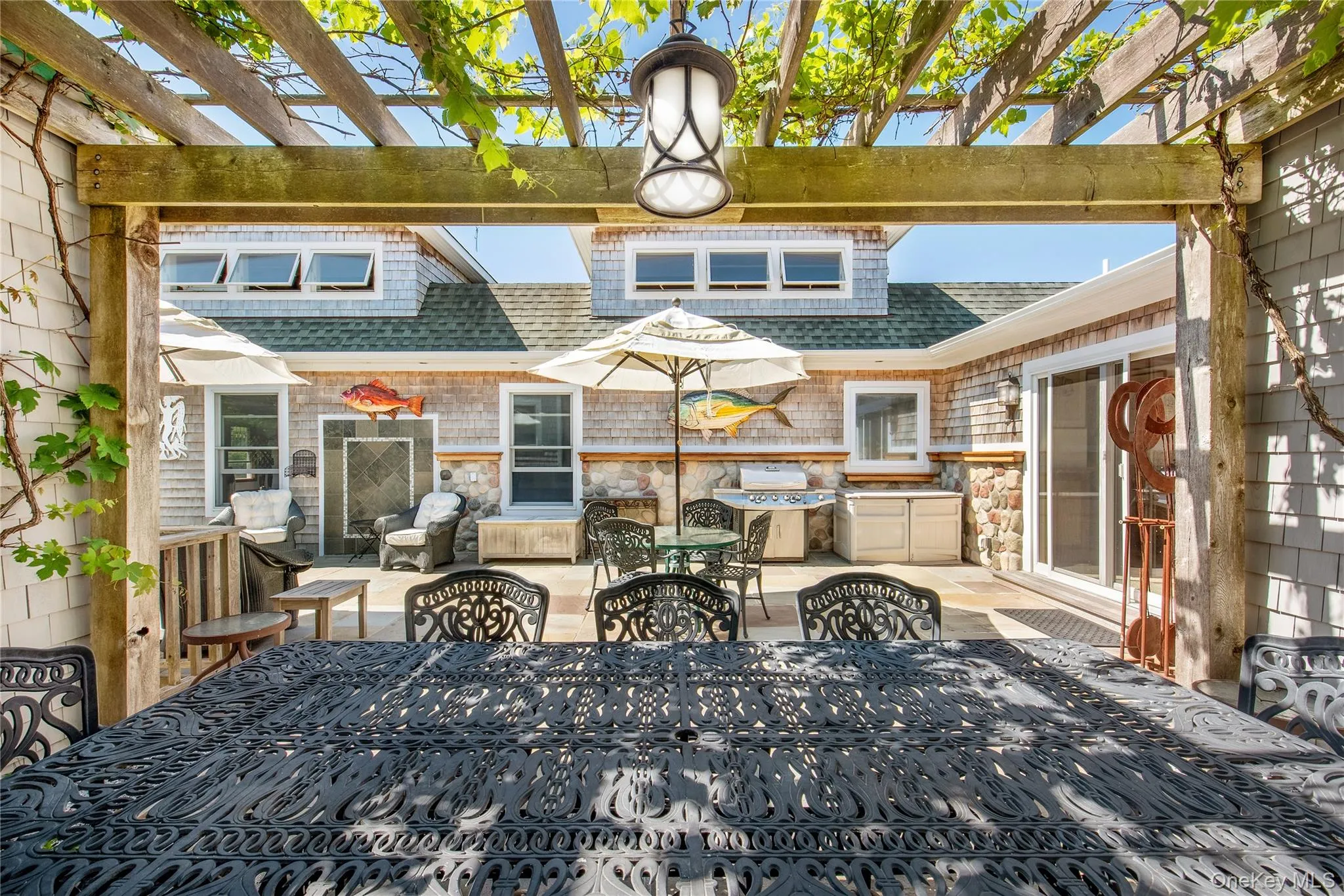View of patio / terrace featuring a pergola and outdoor dining space View of patio / terrace featuring a pergola and outdoor dining space