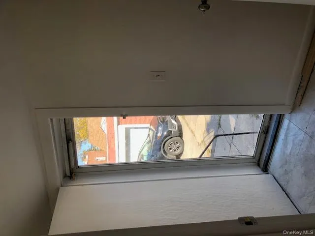 Doorway to outside featuring baseboards Doorway to outside featuring baseboards