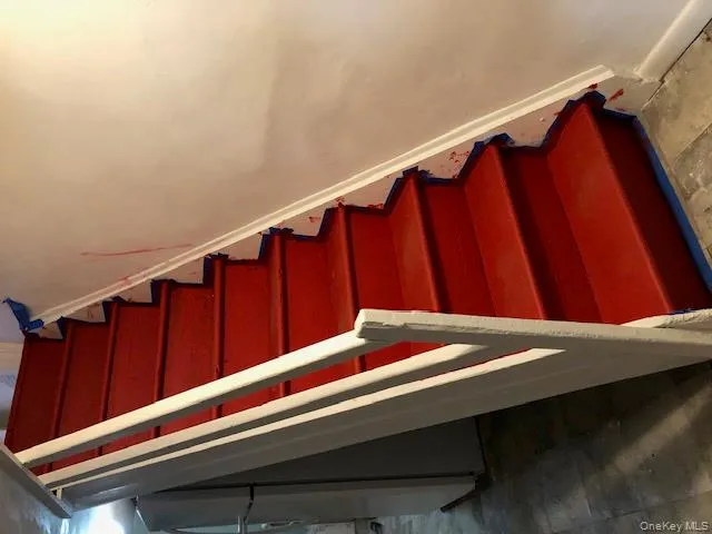Stairway featuring baseboards Stairway featuring baseboards