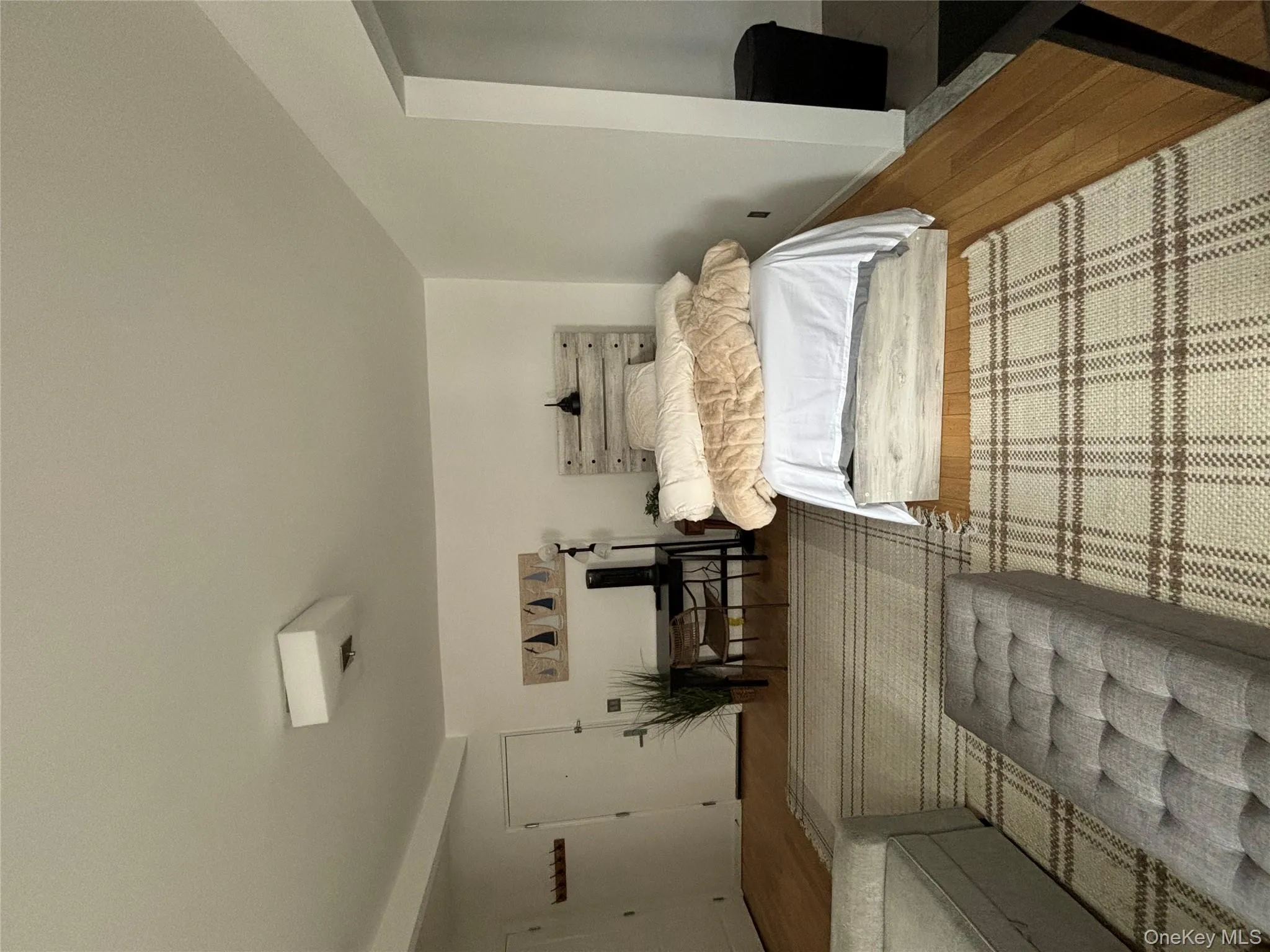 Bedroom featuring wood finished floors Bedroom featuring wood finished floors