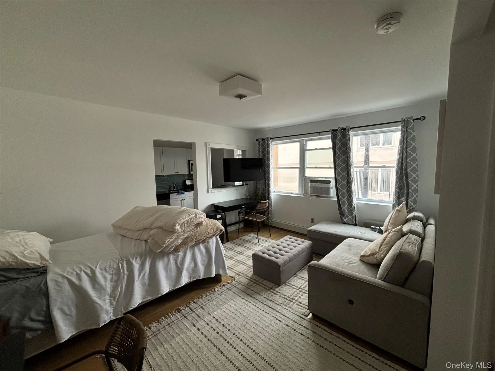 Bedroom featuring wood finished floors Bedroom featuring wood finished floors