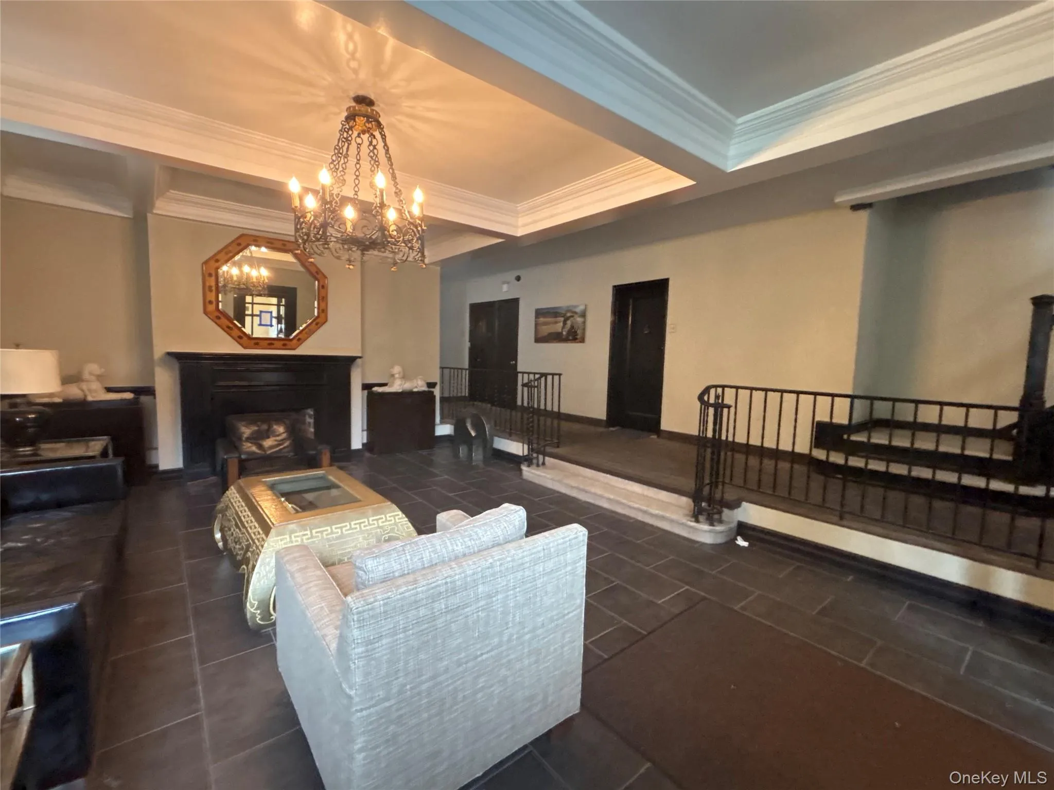Common area featuring crown molding and beamed ceiling Common area featuring crown molding and beamed ceiling