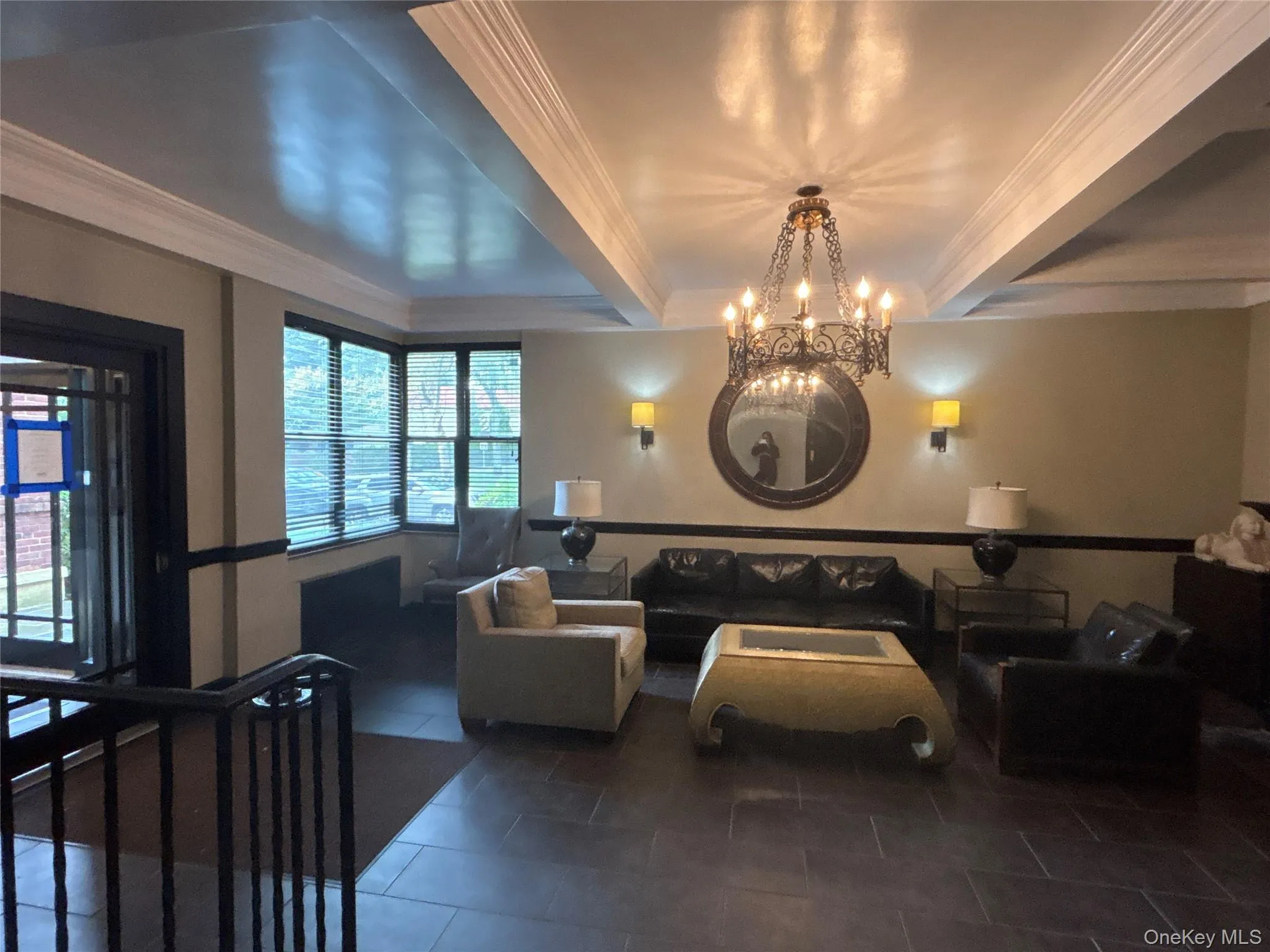 Common area featuring crown molding and beamed ceiling Common area featuring crown molding and beamed ceiling