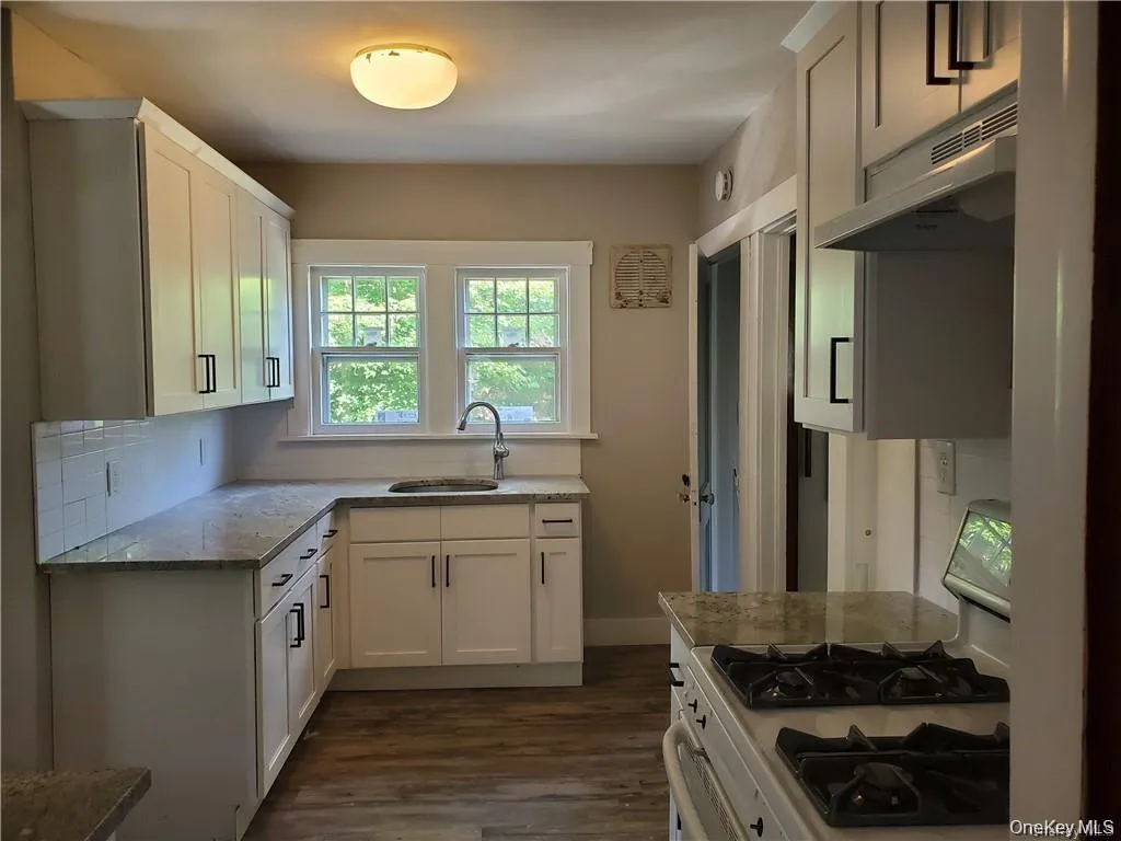 Kitchen with gas range Kitchen with gas range