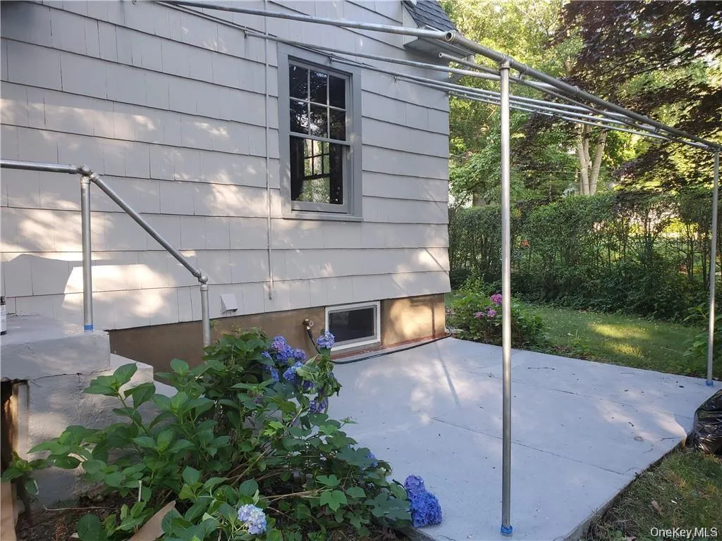 back of home with a patio area back of home with a patio area